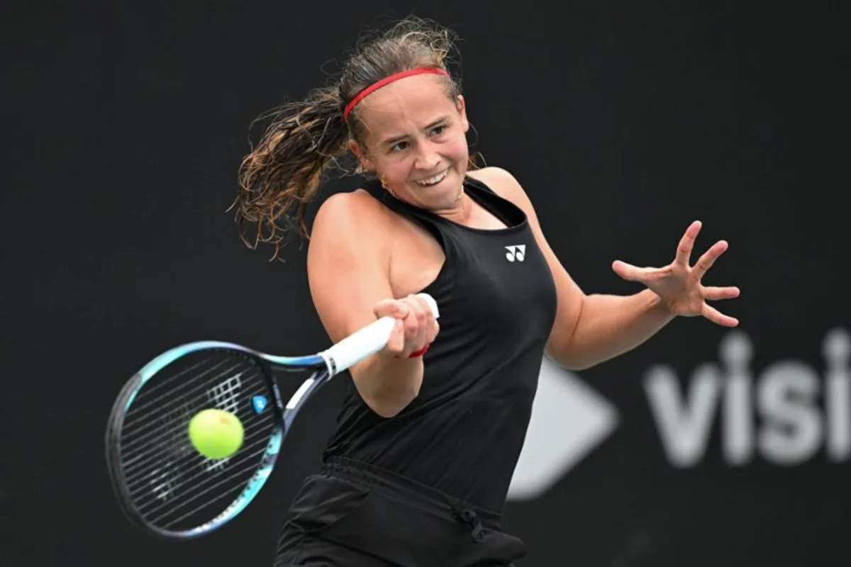 Belgium's Hanne Vandewinkel hits a return to China's Wei Sijia during their women's singles match at the Billie Jean King Cup tennis play-offs at the Guangzhou Nansha International Tennis Center in Guangzhou, in south China's Guangdong province on November 17, 2024.  STR / AFP