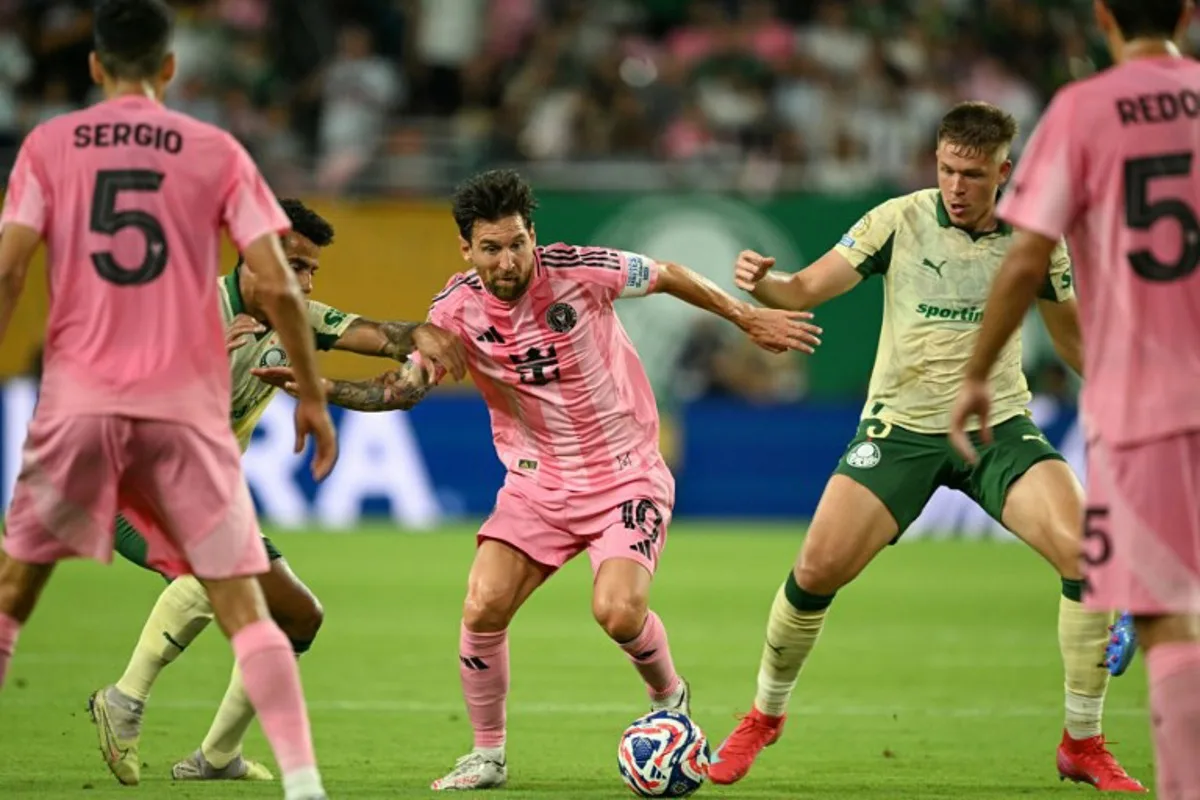 Inter Miami's Argentine forward #10 Lionel Messi (C) fights for the ball with Palmeiras' Brazilian midfielder #30 Lucas Evangelista (2nd L) and Palmeiras' Brazilian defender #03 Bruno Fuchs (2nd R) during the FIFA Club World Cup 2025 Group A football match between US Inter Miami and Brazil's Palmeiras at the Hard Rock stadium in Miami on June 23, 2025. CHANDAN KHANNA / AFP