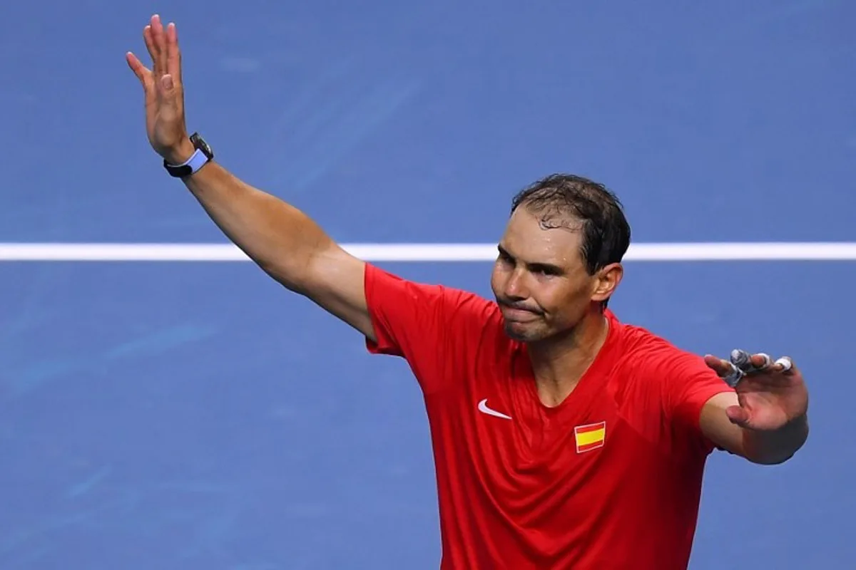 Spain's Rafael Nadal greets the spectators at the end of the quarter-final singles match between Netherlands and Spain during the Davis Cup Finals at the Palacio de Deportes Jose Maria Martin Carpena arena in Malaga, southern Spain, on November 19, 2024. Retiring tennis superstar Rafael Nadal lost in Davis Cup quarter-finals singles. The 22-time Grand Slam winner will call time on his career in professional tennis at the end of Spain's participation in the tournament in Malaga, after two injury-ravaged years. Jorge GUERRERO / AFP