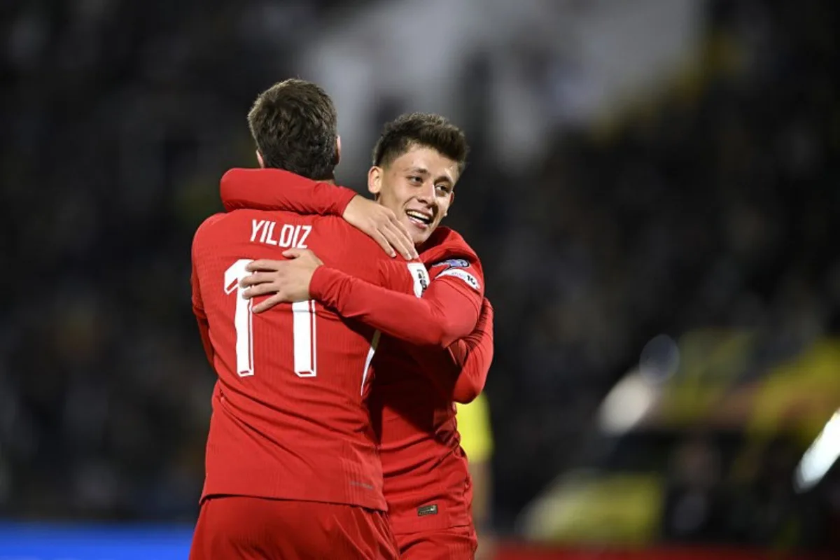 Turkey's forward #11 Kenan Yildiz (L) celebrates with Turkey's midfielder #08 Arda Guler (R) after scoring a goal during the FIFA World Cup 2026 Group E European qualification football match between Bulgaria and Turkey at the Vasil Levski National Stadium in Sofia, on October 11, 2025. Nikolay DOYCHINOV / AFP