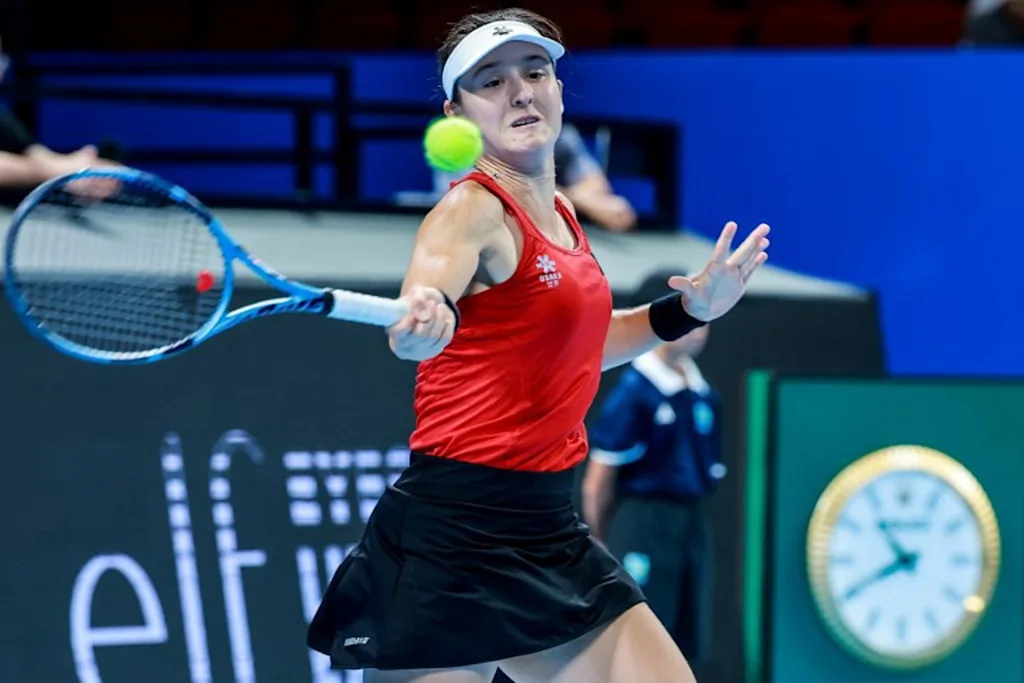 Belgium's Jana Otzipka hits a return to Ukraine's Anhelina Kalinina during their women's singles quarter-final match at the Billie Jean King Cup tennis tournament in Shenzhen, southern China's Guangdong province on September 24, 2026.  CN-STR / AFP