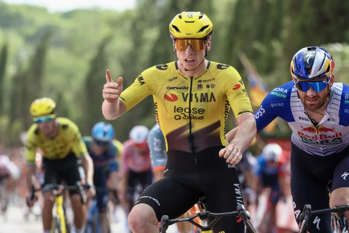 Team Visma-Lease a bike's British rider Matthew Brennan celebrates as he crosses the finish line to win the fifth stage of the Vuelta a Espana 2026, a 173,4 km race between Falset and Roquetes on August 26, 2026. Josep LAGO / AFP