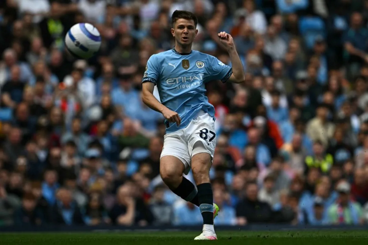 Manchester City's English midfielder #87 James McAtee has this shot saved during the English Premier League football match between Manchester City and Crystal Palace at the Etihad Stadium in Manchester, north west England, on April 12, 2025.  Paul ELLIS / AFP