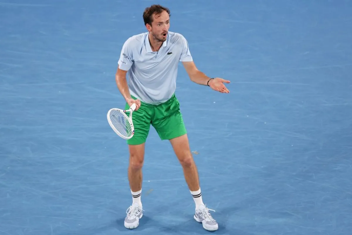 Russia's Daniil Medvedev reacts after a point against USA's Learner Tien during their men's singles match on day five of the Australian Open tennis tournament in Melbourne on January 16, 2025.  Martin KEEP / AFP