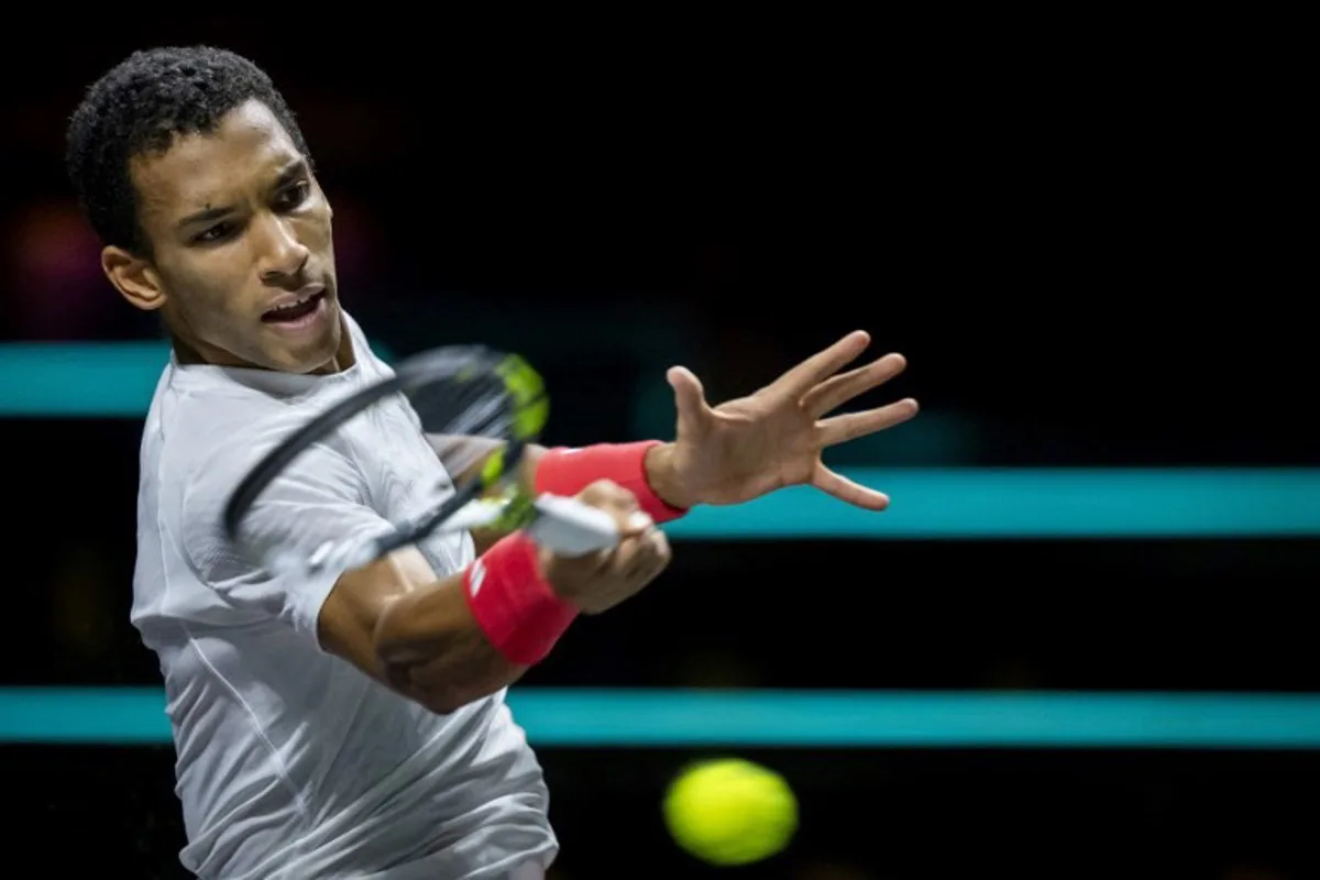 Canada's Felix Auger-Aliassime returns the ball to Italy's Andrea Vavassori, on the third day of the ATP Tour Rotterdam Open tennis tournament at the Ahoy venue in Rotterdam, on February 5, 2025.  Sander Koning / ANP / AFP