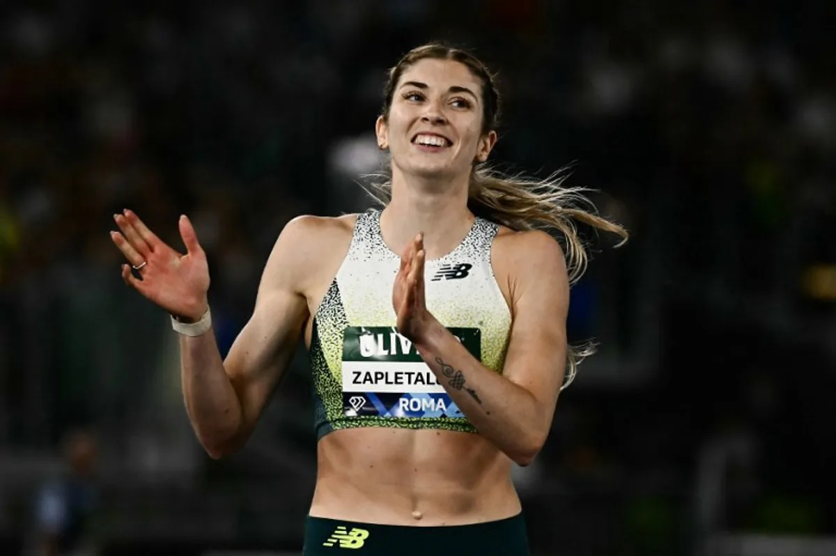 Slovakia's Emma Zapletalova celebrates after winning in the women's 400m Hurdles during the IAAF Diamond League athletics meeting, at the Olympic Stadium, in Rome on June 4, 2026. Filippo MONTEFORTE / AFP