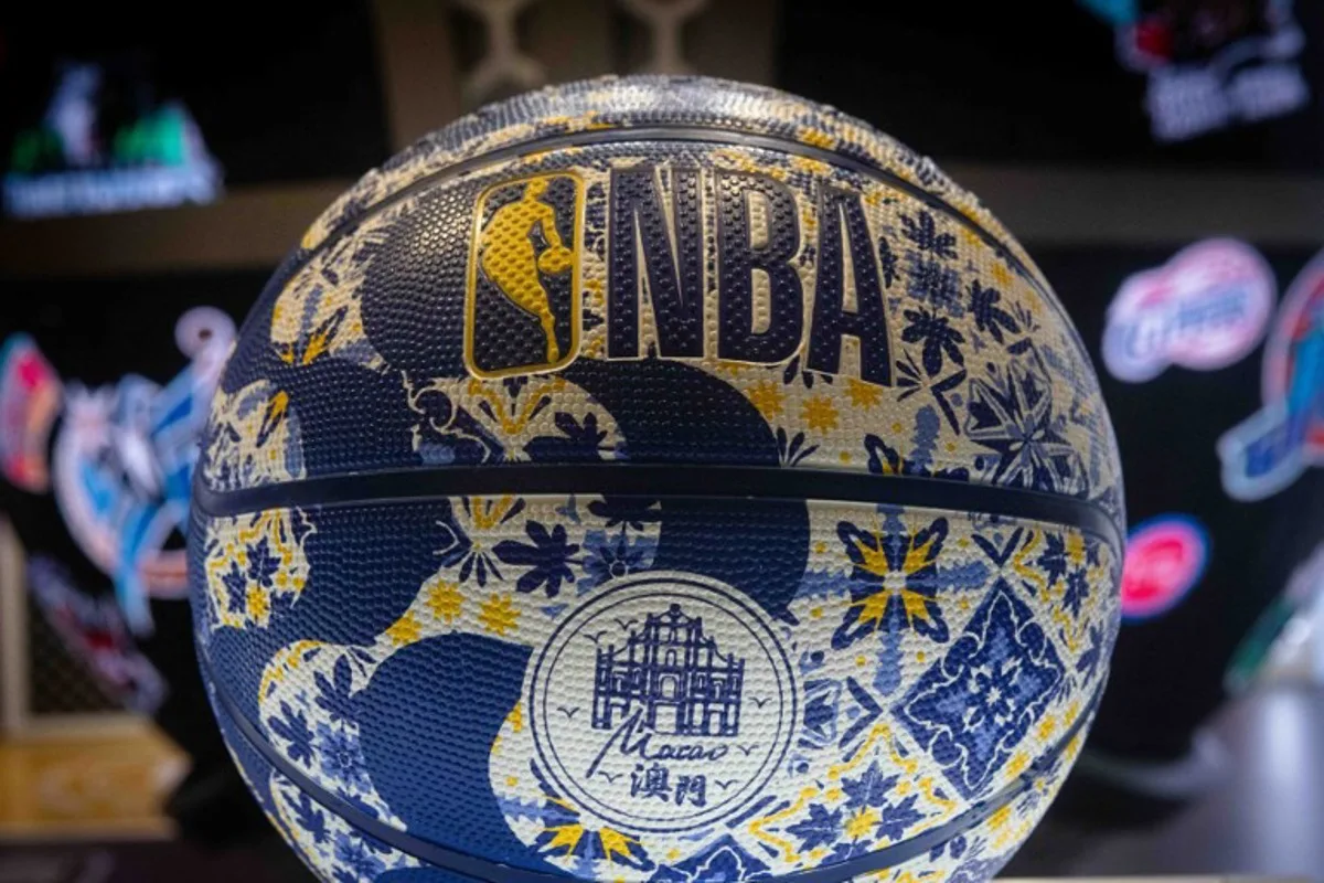 A customised Macau basketball stands at the Wilson stall at the NBA House before the NBA pre-season basketball game between the Phoenix Suns and Brooklyn Nets at the Venetian Arena in Macau on October 12, 2025.  Eduardo Leal / AFP