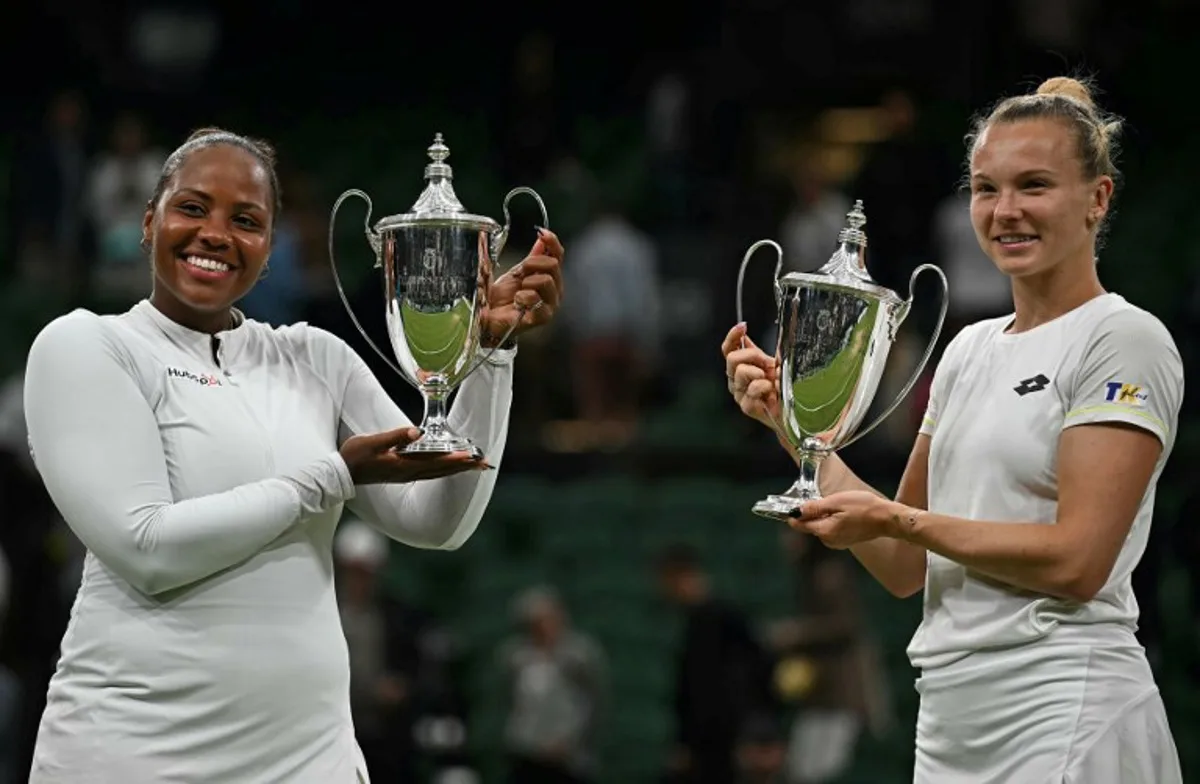 Winners USA's Taylor Townsend (L) and Czech Republic's Katerina Siniakova pose with their trophies following their victory against Canada's Gabriela Dabrowski and New Zealand's Erin Routliffe at the end of their women's doubles final tennis match on the thirteenth day of the 2024 Wimbledon Championships at The All England Lawn Tennis and Croquet Club in Wimbledon, southwest London, on July 13, 2024. Ben Stansall / AFP