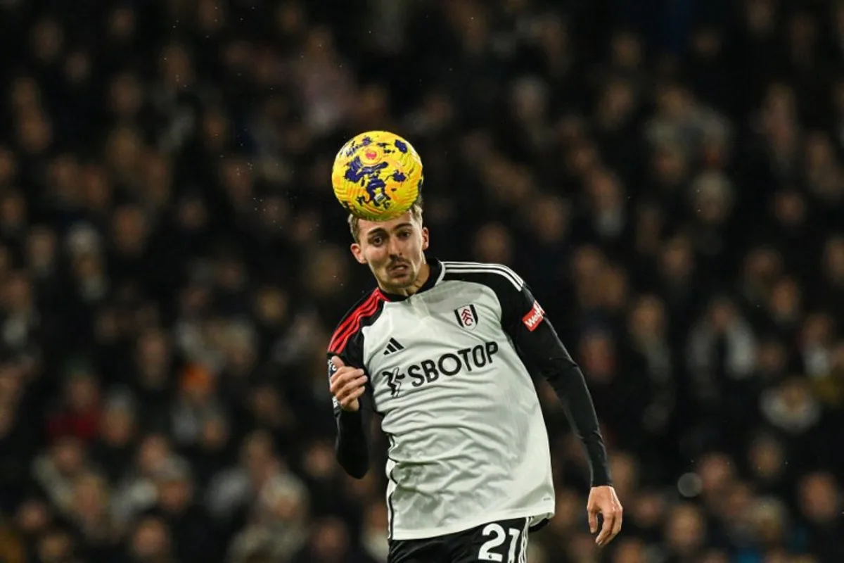 Fulham's Belgian defender #21 Timothy Castagne heads the ball during the English Premier League football match between Fulham and Wolverhampton Wanderers at Craven Cottage, in London, on November 27, 2023.  Glyn KIRK / AFP