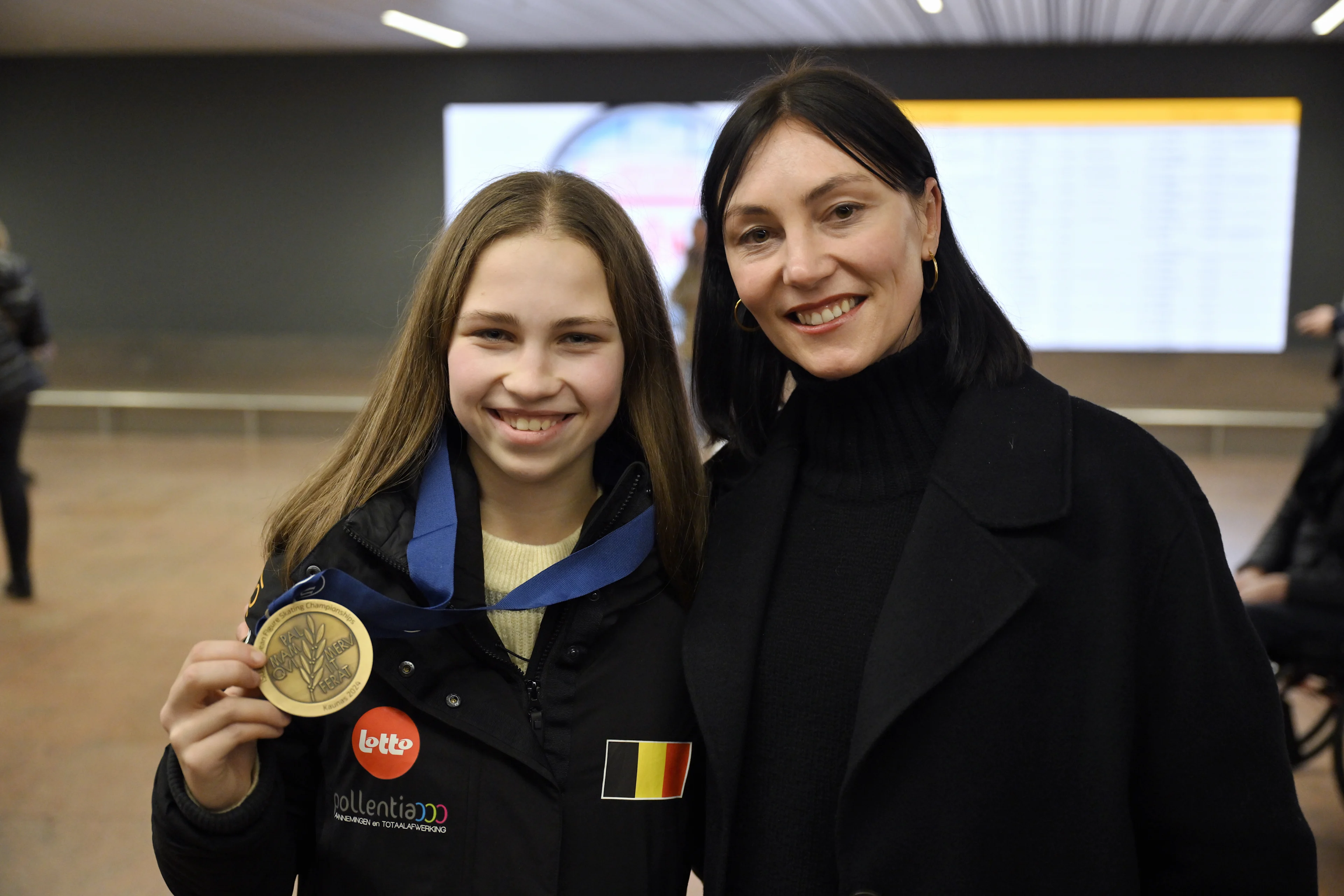 European bronze medalist Figure skater Nina Pinzarrone and Figure skating coach Ans Bocklandt pose for the photographer at the return of Belgian athletes who competed at the European figure skating chaqmpionships, Monday 15 January 2024, at Brussels airport in Zaventem. Belgium has an European title for the first time and also a bronze medal. BELGA PHOTO ERIC LALMAND