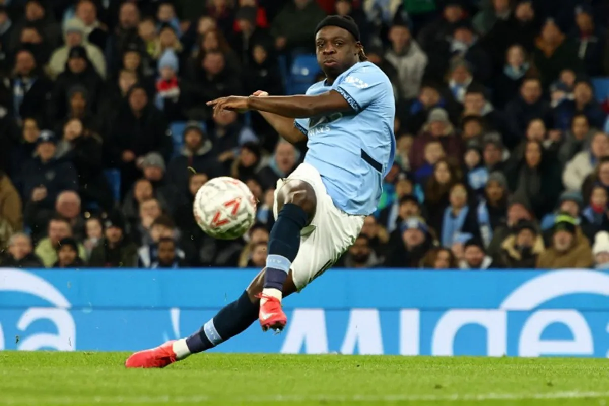 Manchester City's Belgian midfielder #11 Jeremy Doku celebrates scoring the opening goal during the English FA Cup third round football match between Manchester City and Salford City at the Etihad Stadium in Manchester, north west England, on January 11, 2025.  Darren Staples / AFP