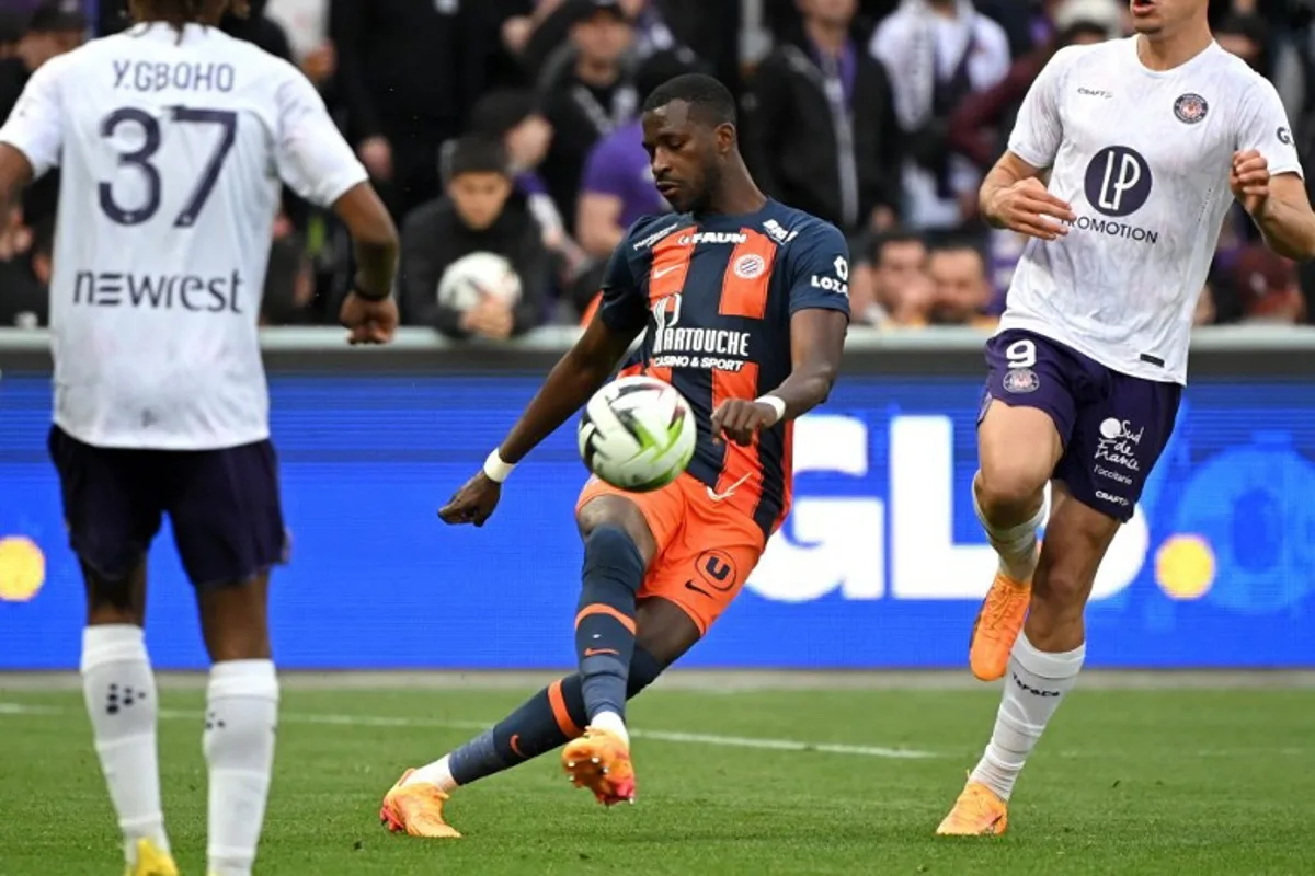 Montpellier's Malian defender #04 Boubakar Kouyate kicks the ball during the French L1 football match between Toulouse FC and Montpellier Herault SC at the TFC Stadium in Toulouse, southwestern France, on May 3, 2024. Matthieu RONDEL / AFP