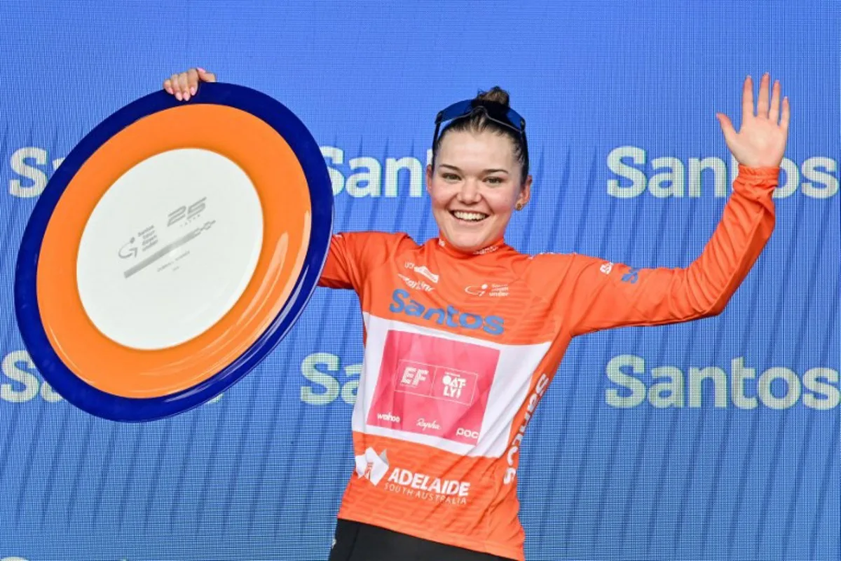 EF Education - Oatly rider Noemi Ruegg from Switzerland celebrates with her trophy after being crowned overall winner of the Tour Down Under cycling race in Adelaide on January 19, 2025.  Brenton Edwards / AFP