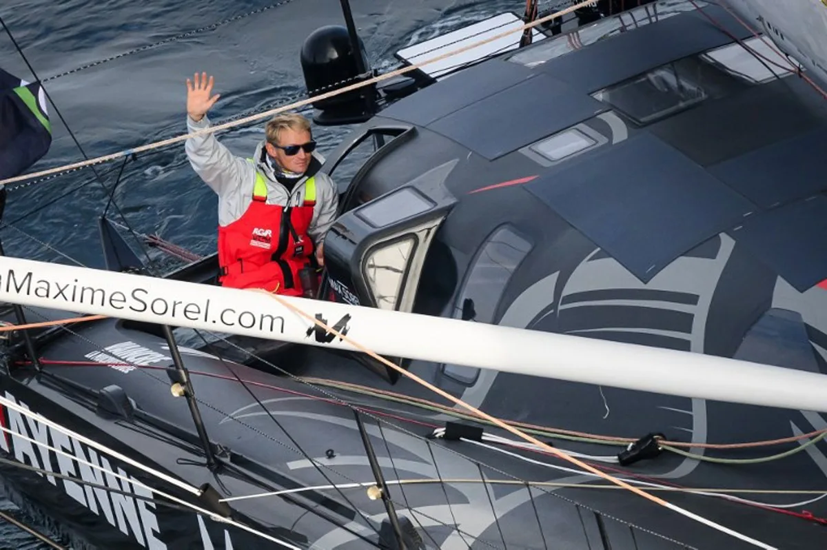 French skipper Maxime Sorel sails his Imoca 60 monohull "V and B - Monbana - Mayenne" after the start of the 10th edition of the Vendee Globe around the world monohull solo sailing race, off the coast of Les Sables-d'Olonne, western France, on November 10, 2024.  Loic VENANCE / AFP