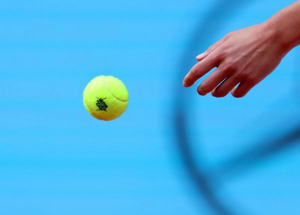 Poland's Iga Swiatek throws a ball during her 2024 WTP Tour Madrid Open tournament tennis match against US' Madison Keys at Caja Magica in Madrid on May 2, 2024.  PIERRE-PHILIPPE MARCOU / AFP