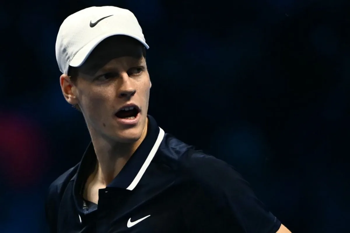 Italy's Jannik Sinner reacts during his match against Russia's Daniil Medvedev at the ATP Finals tennis tournament in Turin on November 14, 2024.  Marco BERTORELLO / AFP