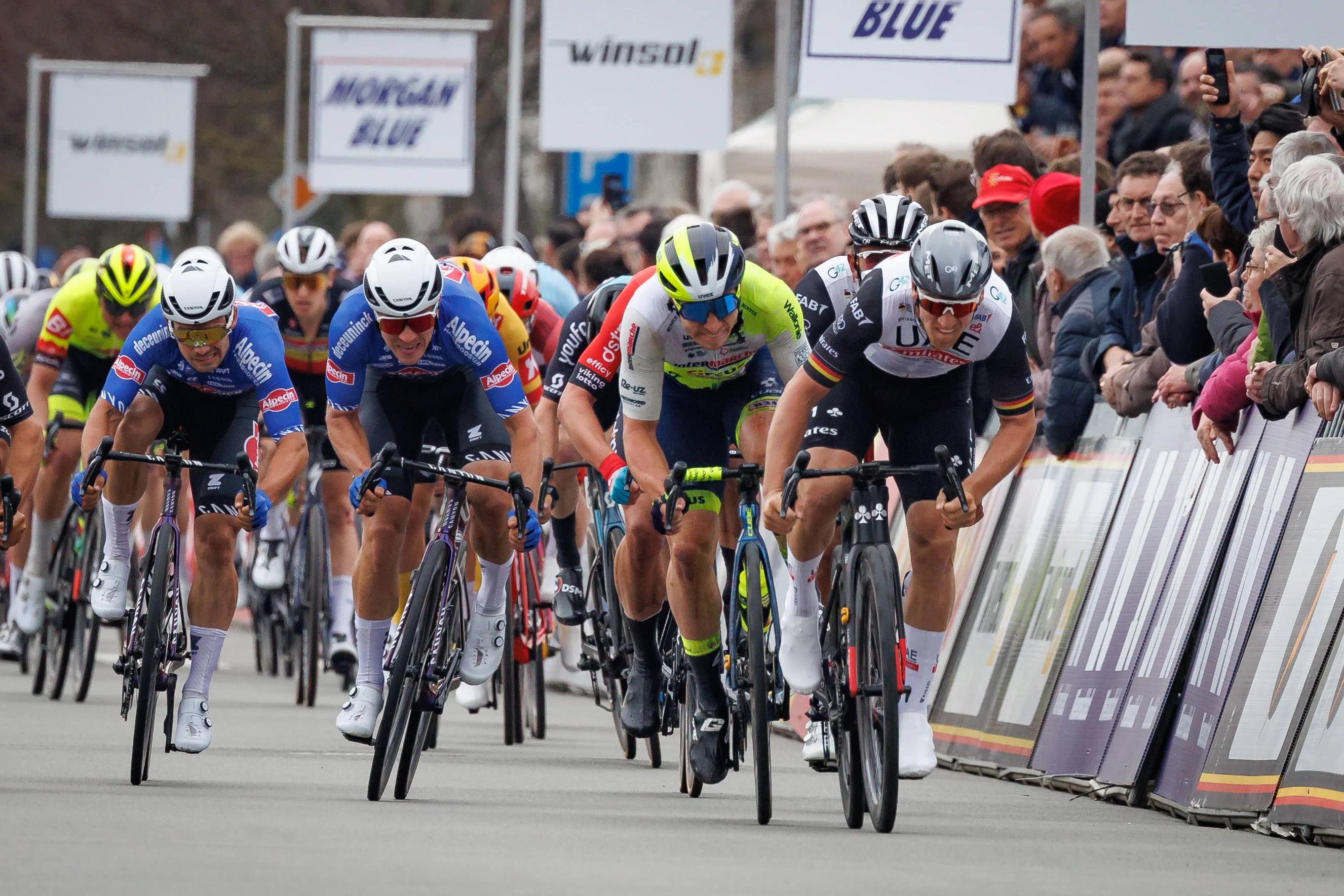 Belgian Gerben Thijssen of Intermarche-Circus-Wanty (C) wins before German Pascal Ackermann of UAE Team Emirates (R) the sprint at the finish of the 'Bredene Koksijde Classic' one day cycling race, 191,6 km from Bredene to Koksijde, Friday 17 March 2023. BELGA PHOTO KURT DESPLENTER