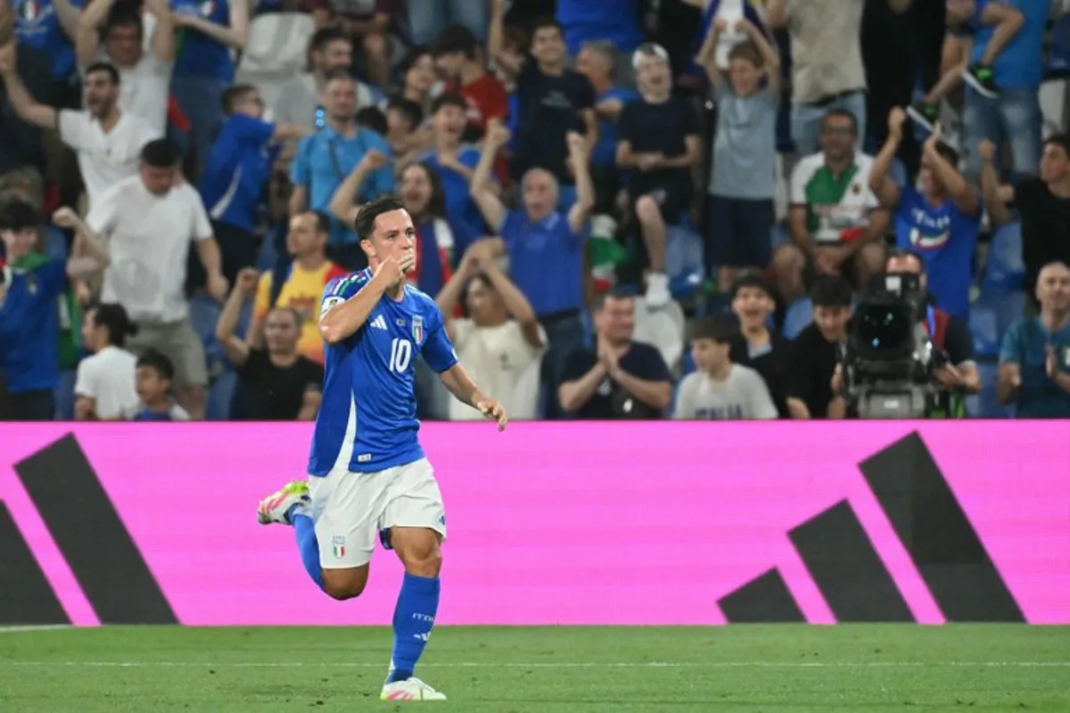 Italy's forward #10 Giacomo Raspadori celebrates scoring his team's first goal during the 2026 World Cup qualifiers Europe zone group I football match between Italy and Moldova at the Mapei Stadium in Reggio Emilia, on June 9, 2025. Alberto PIZZOLI / AFP