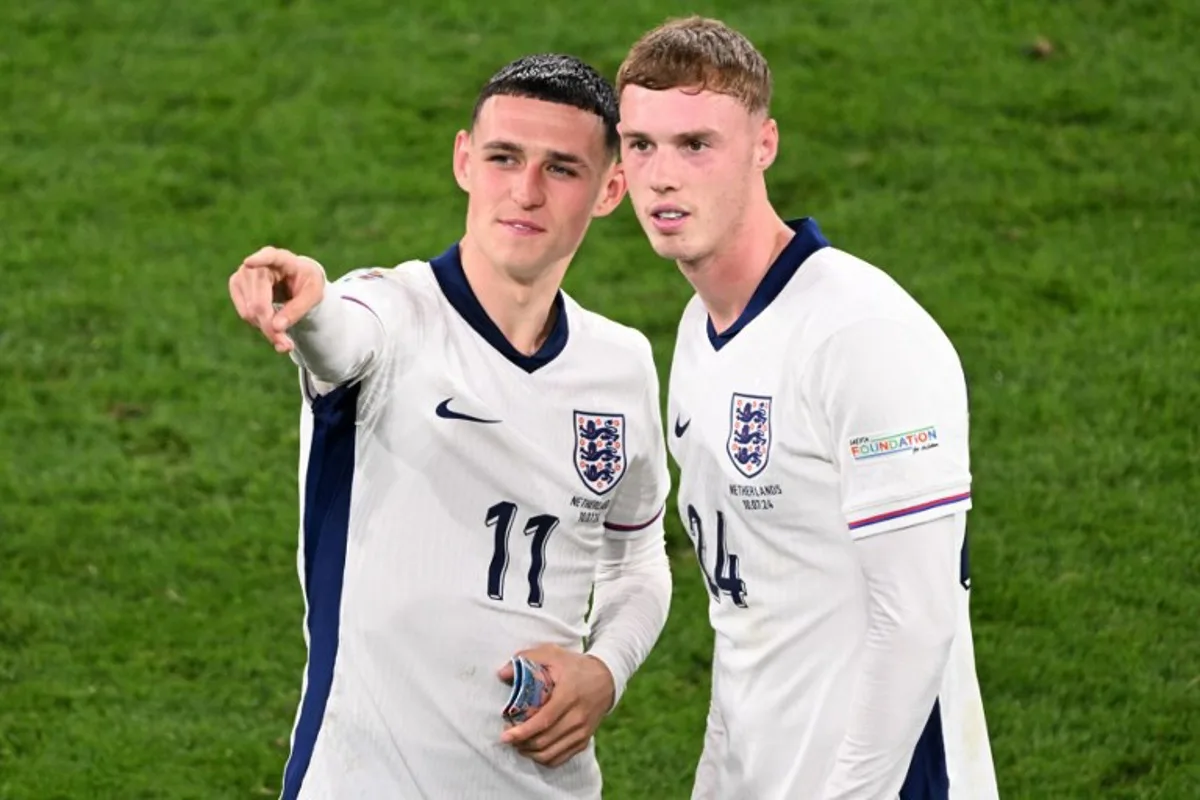 England's midfielder #11 Phil Foden and England's midfielder #24 Cole Palmer celebrate at the end of the UEFA Euro 2024 semi-final football match between the Netherlands and England at the BVB Stadion in Dortmund on July 10, 2024. Kirill KUDRYAVTSEV / AFP