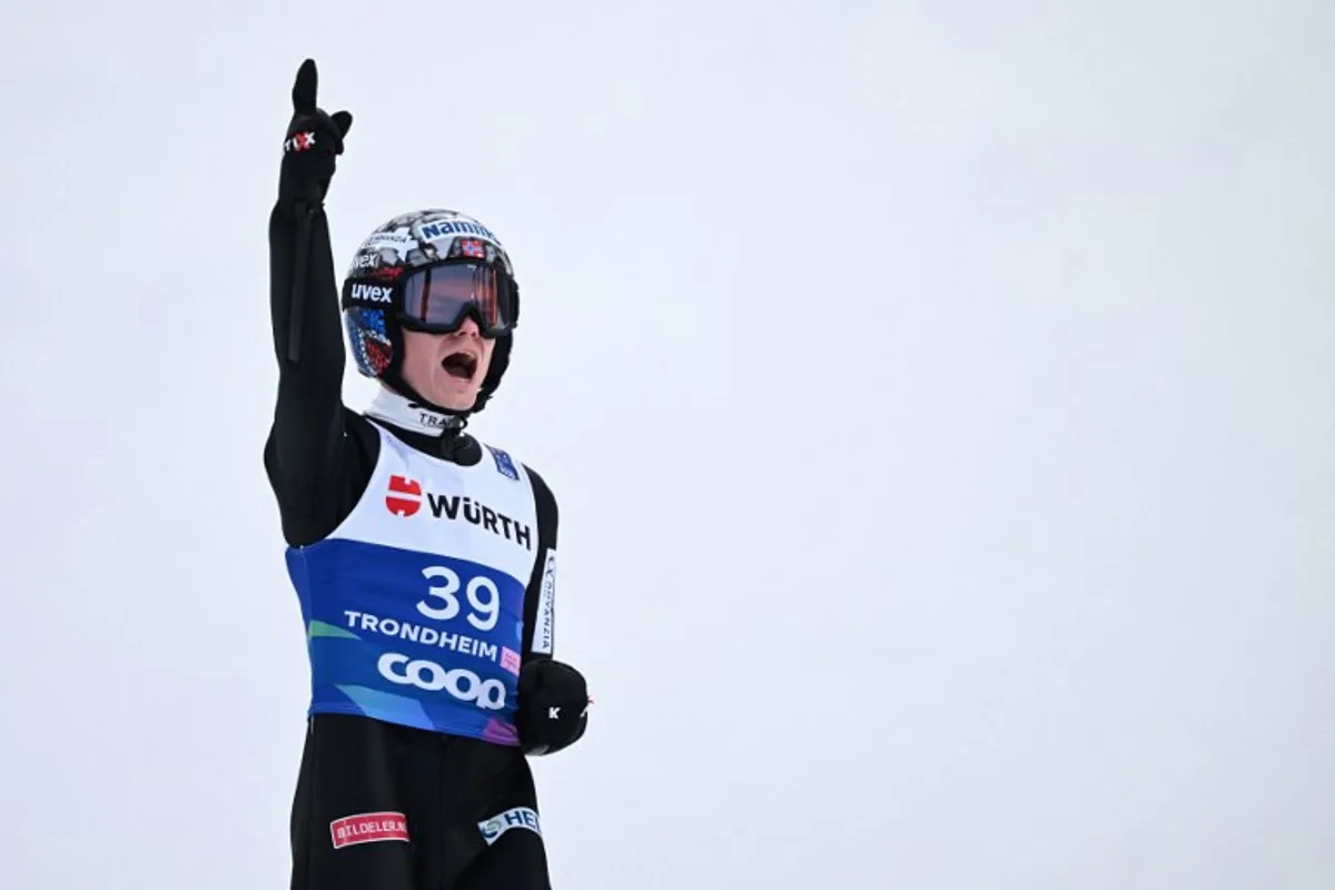 Norway's Marius Lindvik reacts after his jump in the second run of the men's Individual Large Hill HS138 event of the FIS Nordic World Ski Championships in Trondheim, Norway on March 8, 2025.   Jonathan NACKSTRAND / AFP