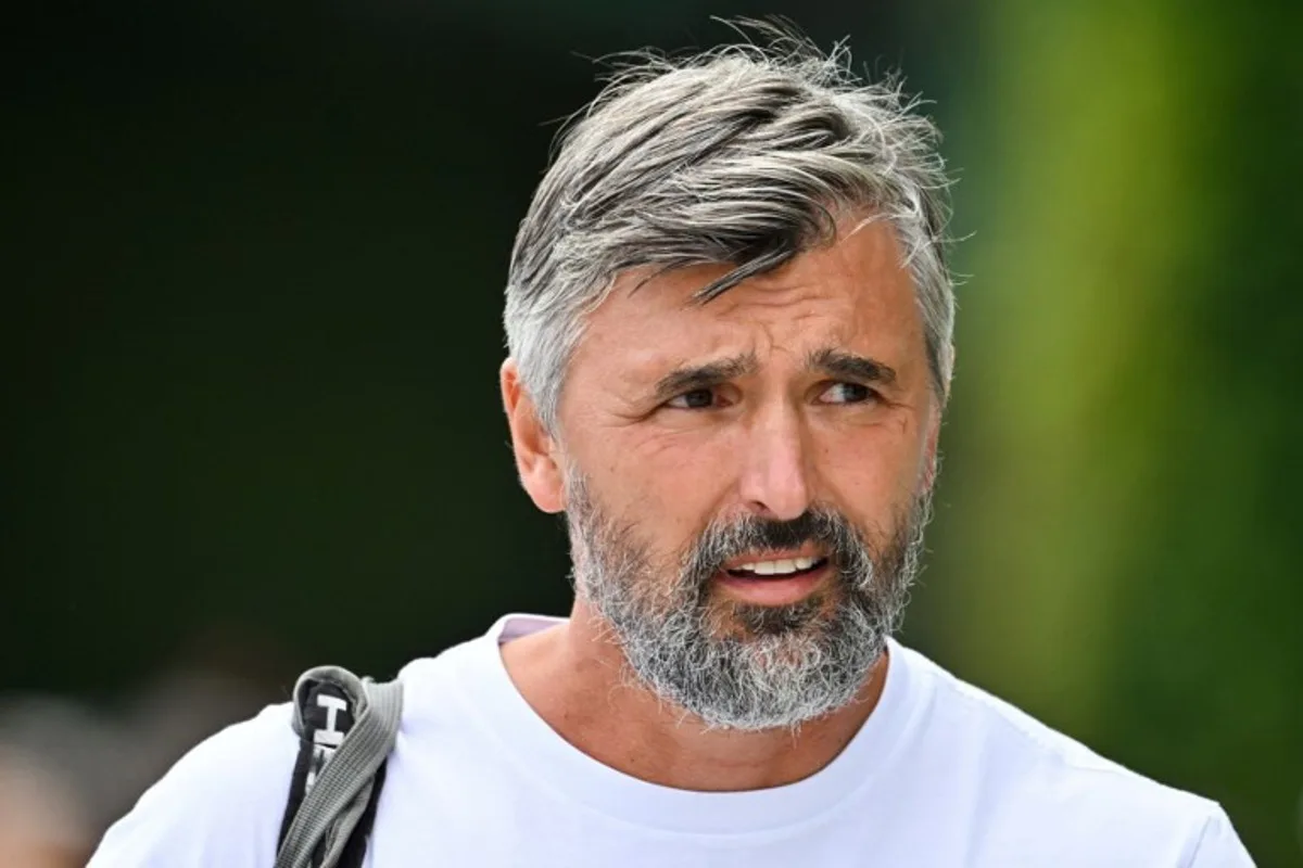 Goran Ivanisevic, the coach of Serbia's Novak Djokovic, reacts as he arrives to take part in a training session prior to the start of the 2023 Wimbledon Championships at The All England Tennis Club in Wimbledon, southwest London, on July 2, 2023.   Glyn KIRK / AFP