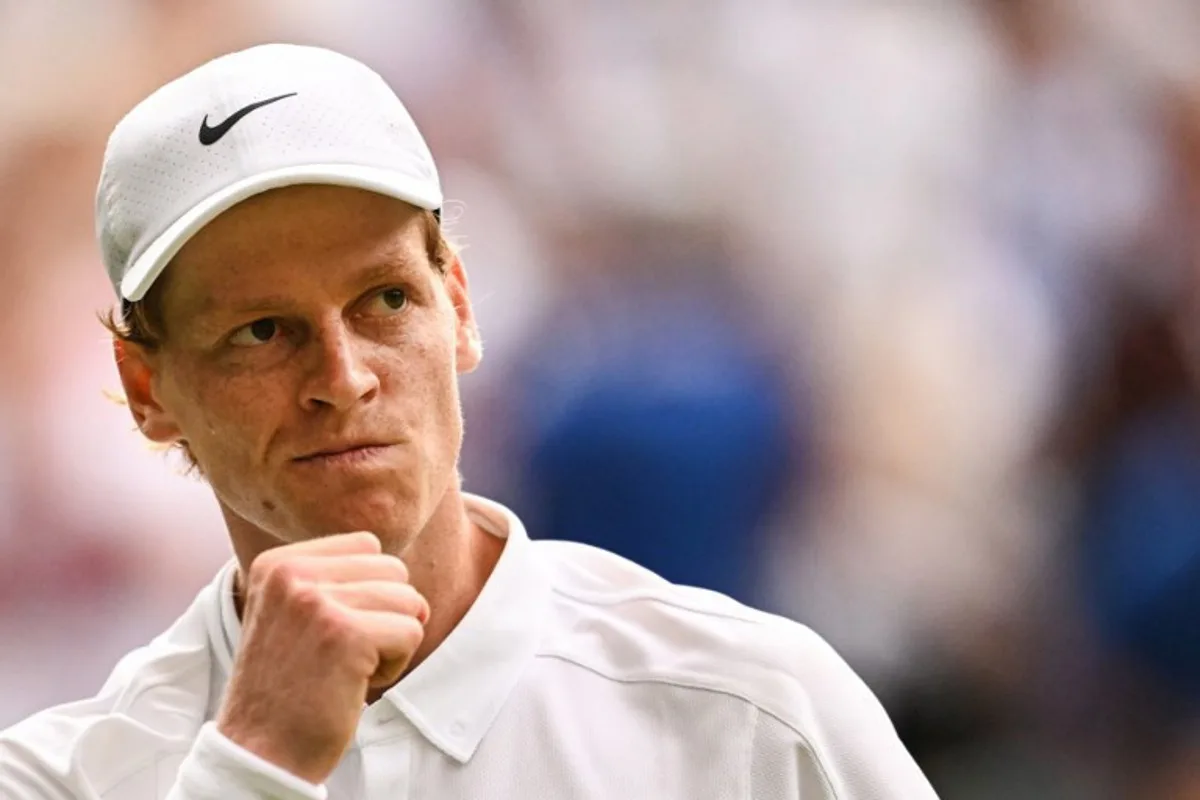 Italy's Jannik Sinner reacts after winning a game against Spain's Carlos Alcaraz during their men's singles final tennis match on the fourteenth day of the 2025 Wimbledon Championships at The All England Lawn Tennis and Croquet Club in Wimbledon, southwest London, on July 13, 2025. Kirill KUDRYAVTSEV / AFP