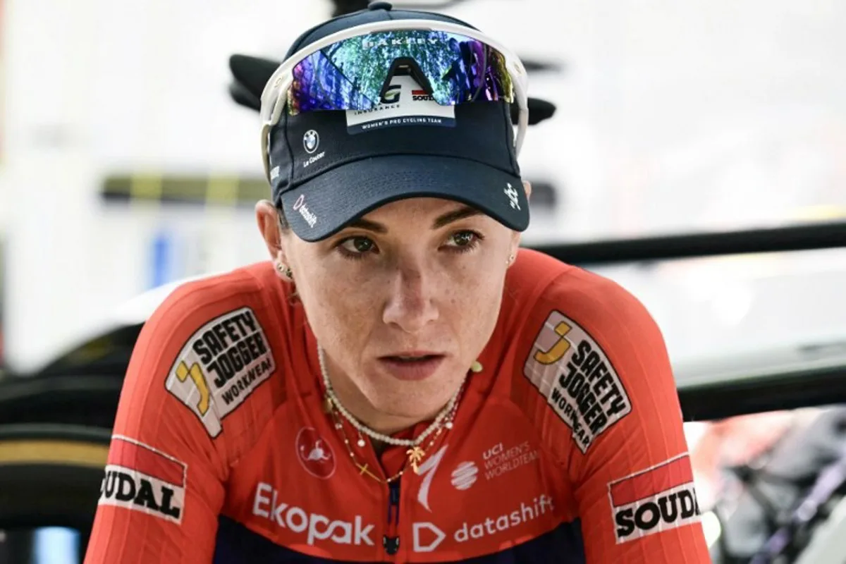 AG Insurance-Soudal Team's Mauritian rider Kim Le Court-Pienaar looks on after winning the 6th (out of 9) stage of the fifth edition of the Women's Tour de France cycling race, 153.4 km from Montbrison to Tournon-sur-Rhone, in Tournon-sur-Rhone, central-eastern France on August 6, 2026.  NICOLAS TUCAT / AFP