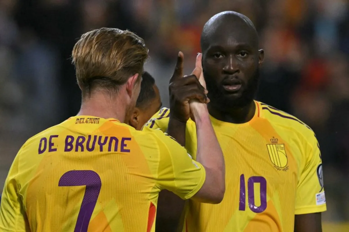 Belgium's forward #10 Romelu Lukaku celebrates with Belgium's midfielder #07 Kevin De Bruyne (L) after scoring Belgium's fourth goal during the FIFA World Cup 2026 Group J European qualification football match between Belgium and Wales at the King Baudouin Stadium in Brussels, on June 9, 2025. NICOLAS TUCAT / AFP