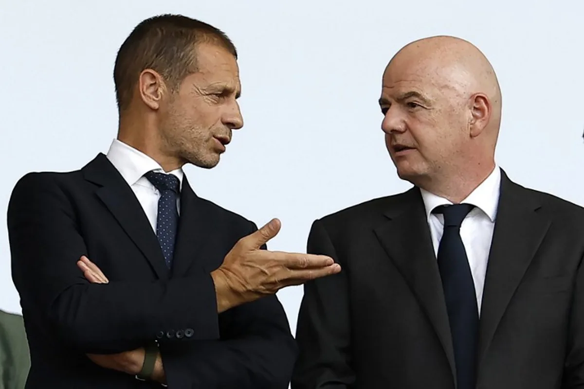 UEFA president Aleksander Ceferin (L) speaks with Fifa president Gianni Infantino before the start of the UEFA Euro 2024 round of 16 football match between Switzerland and Italy at the Olympiastadion Berlin in Berlin on June 29, 2024.  Odd ANDERSEN / AFP