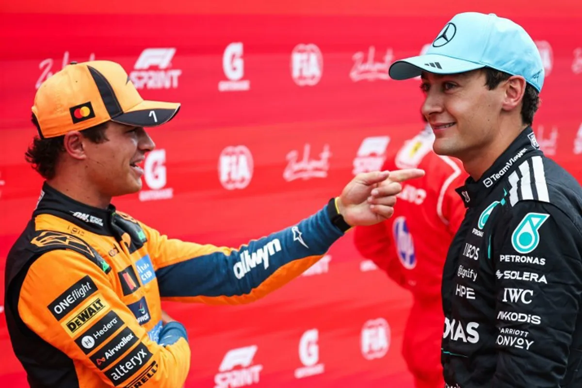 P2 McLaren's British driver Lando Norris (L) speaks with P1 Mercedes' British driver George Russell after the sprint race ahead of the Formula One Dutch Grand Prix at The Circuit Zandvoort, western Netherlands, on August 22, 2026.  SIMON WOHLFAHRT / AFP