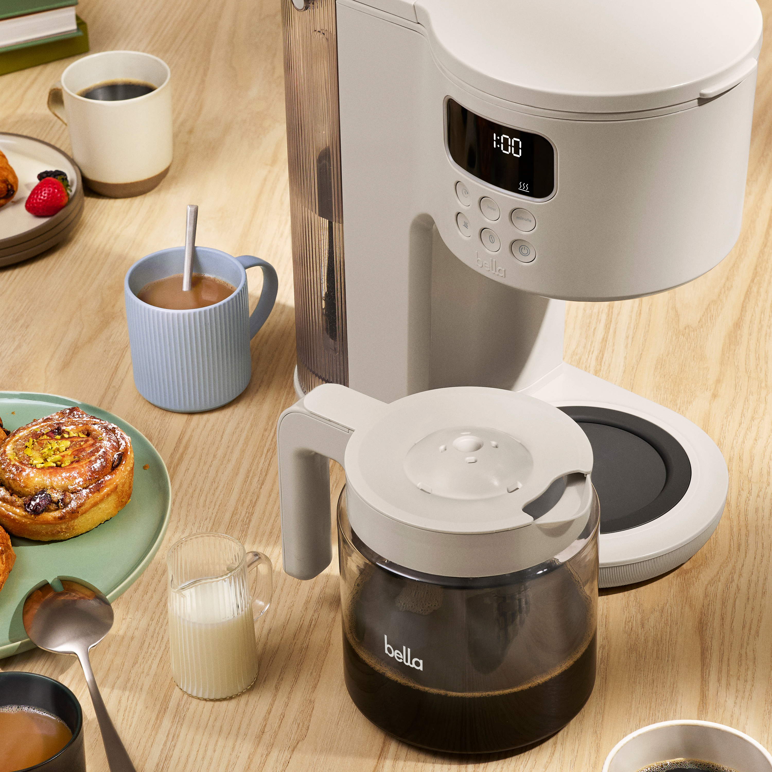 Overhead shot of coffee machine on counter with carafe full of coffee.