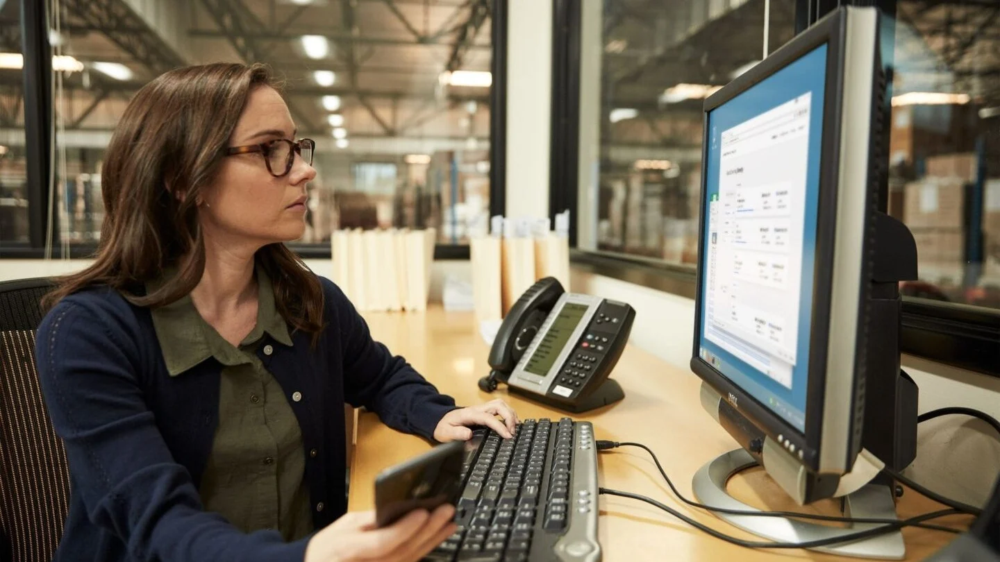 Woman working at desk.