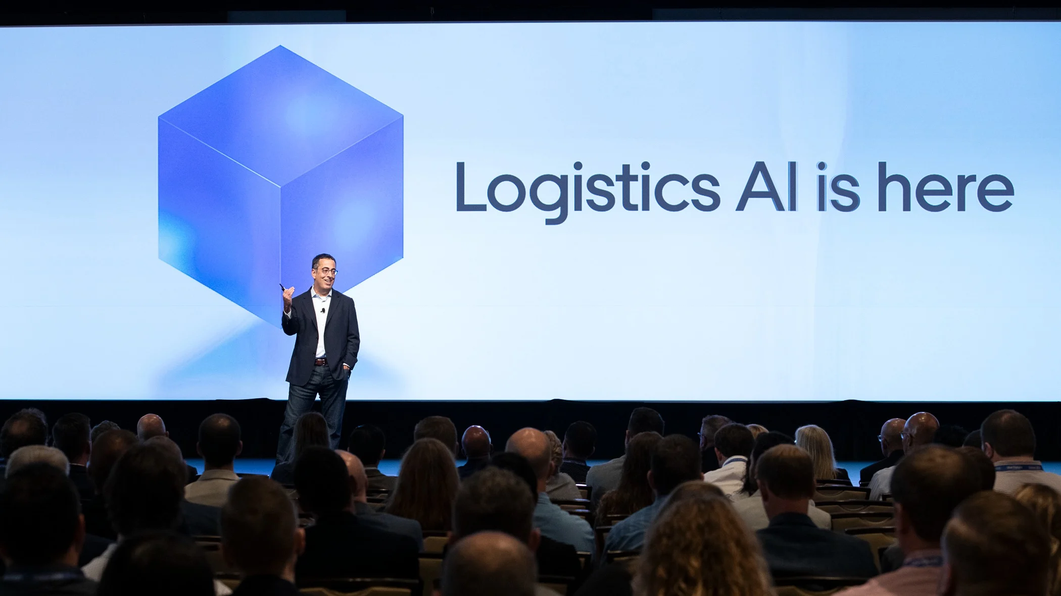 Man speaking at conference.