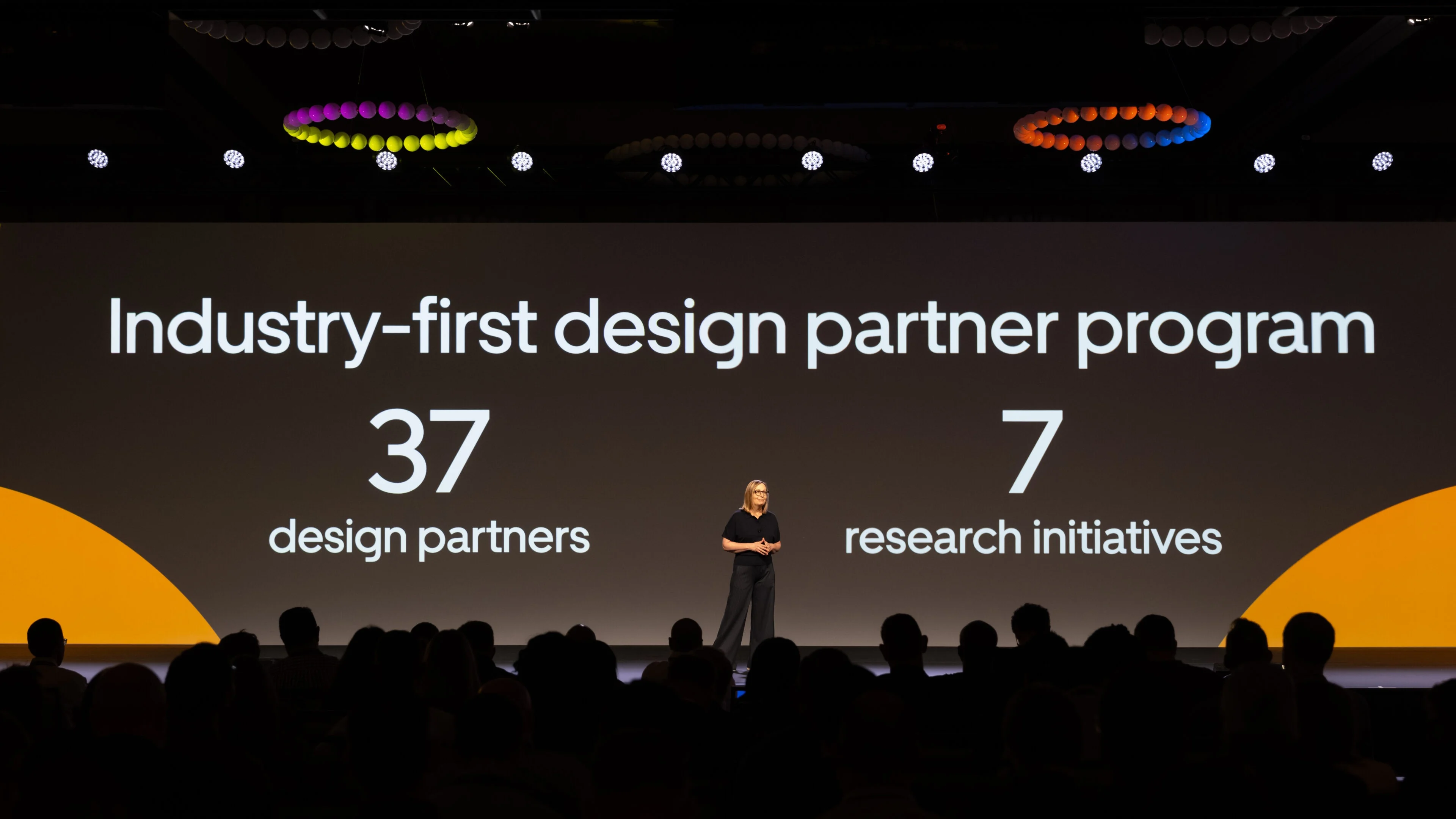 Woman on stage at conference.