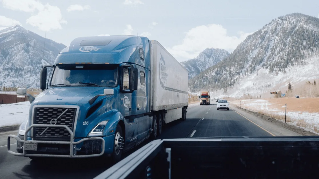 Truck on snowy road.