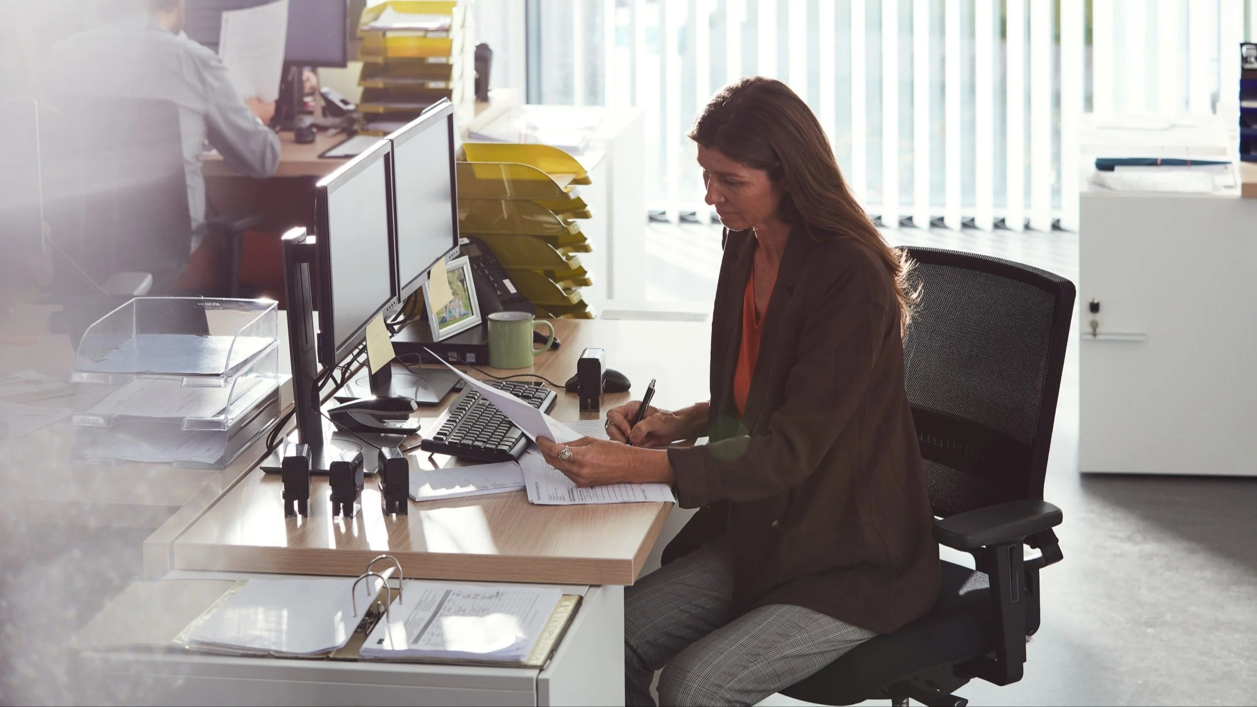 Woman working at desk.