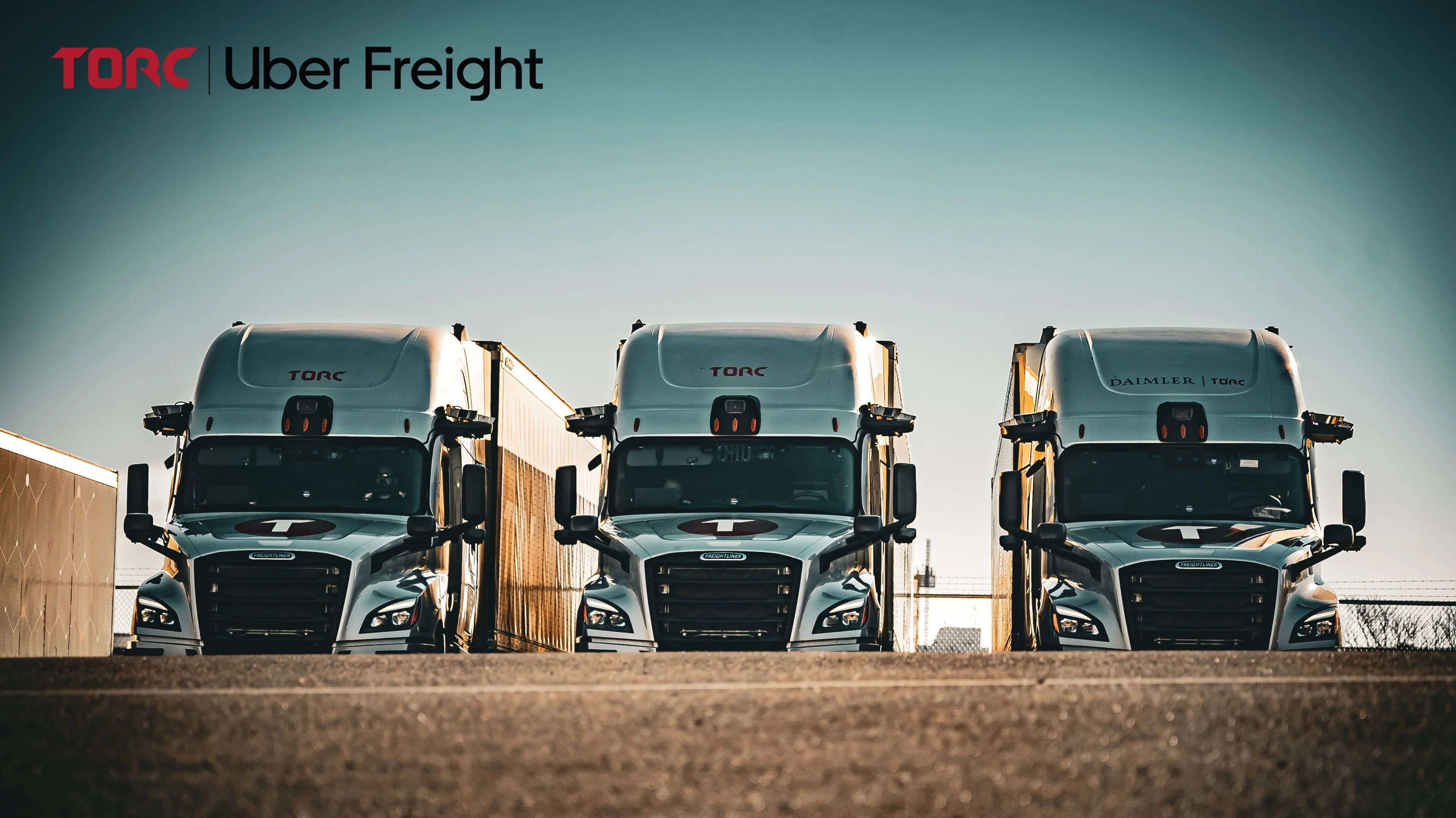 Three trucks parked in a row.