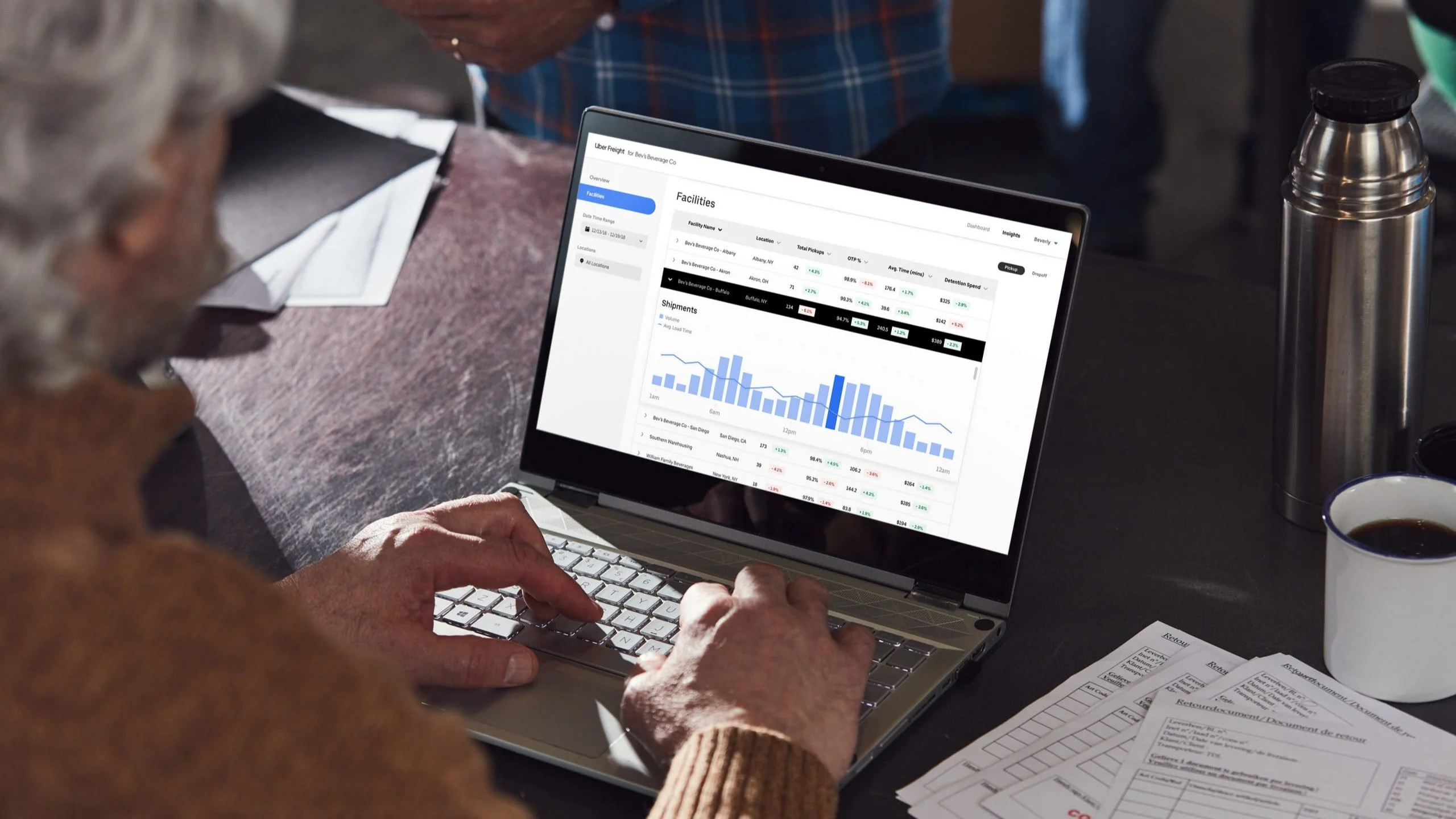 Person looking at shipping software on a laptop.