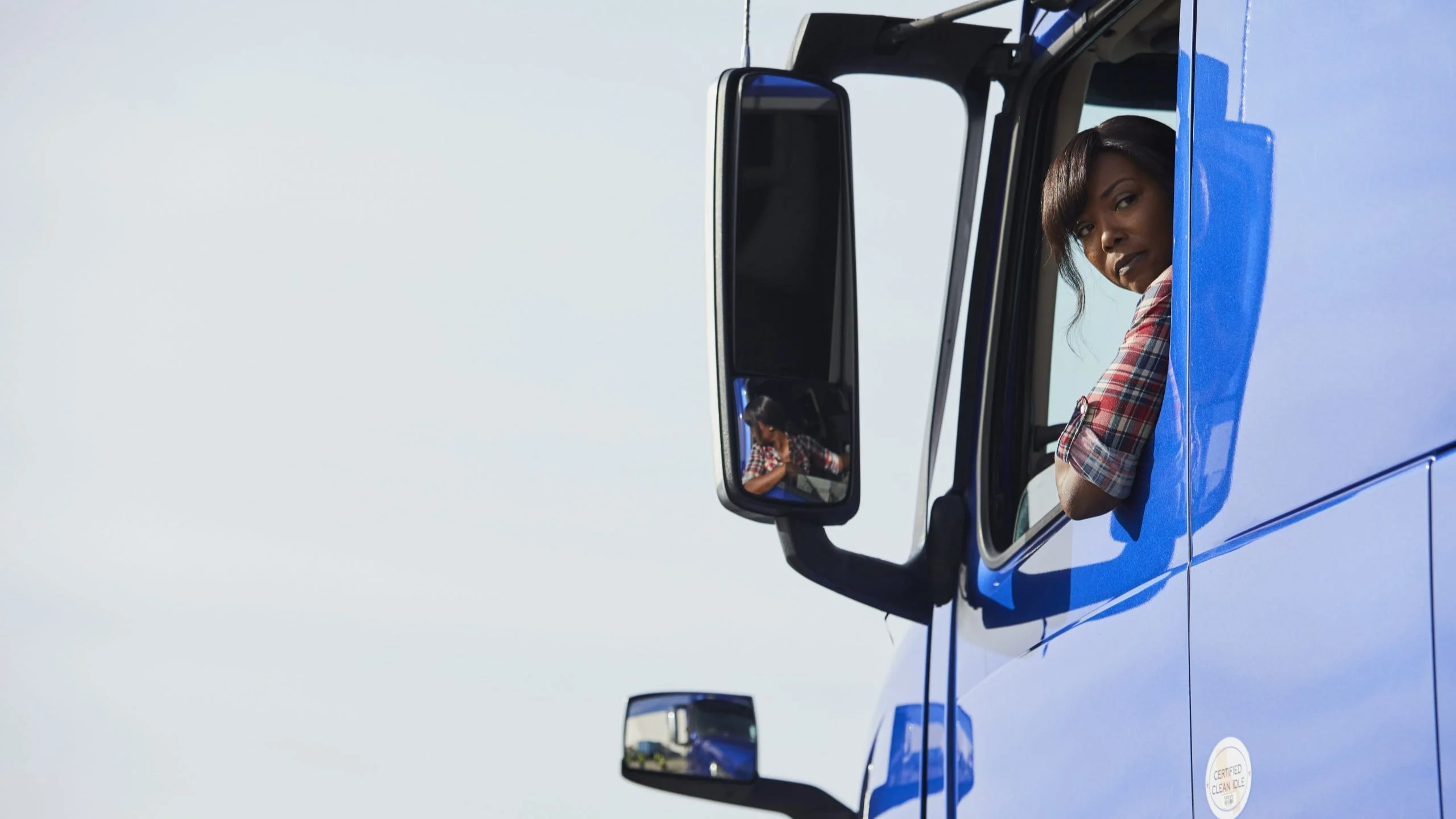 Woman driving a truck.