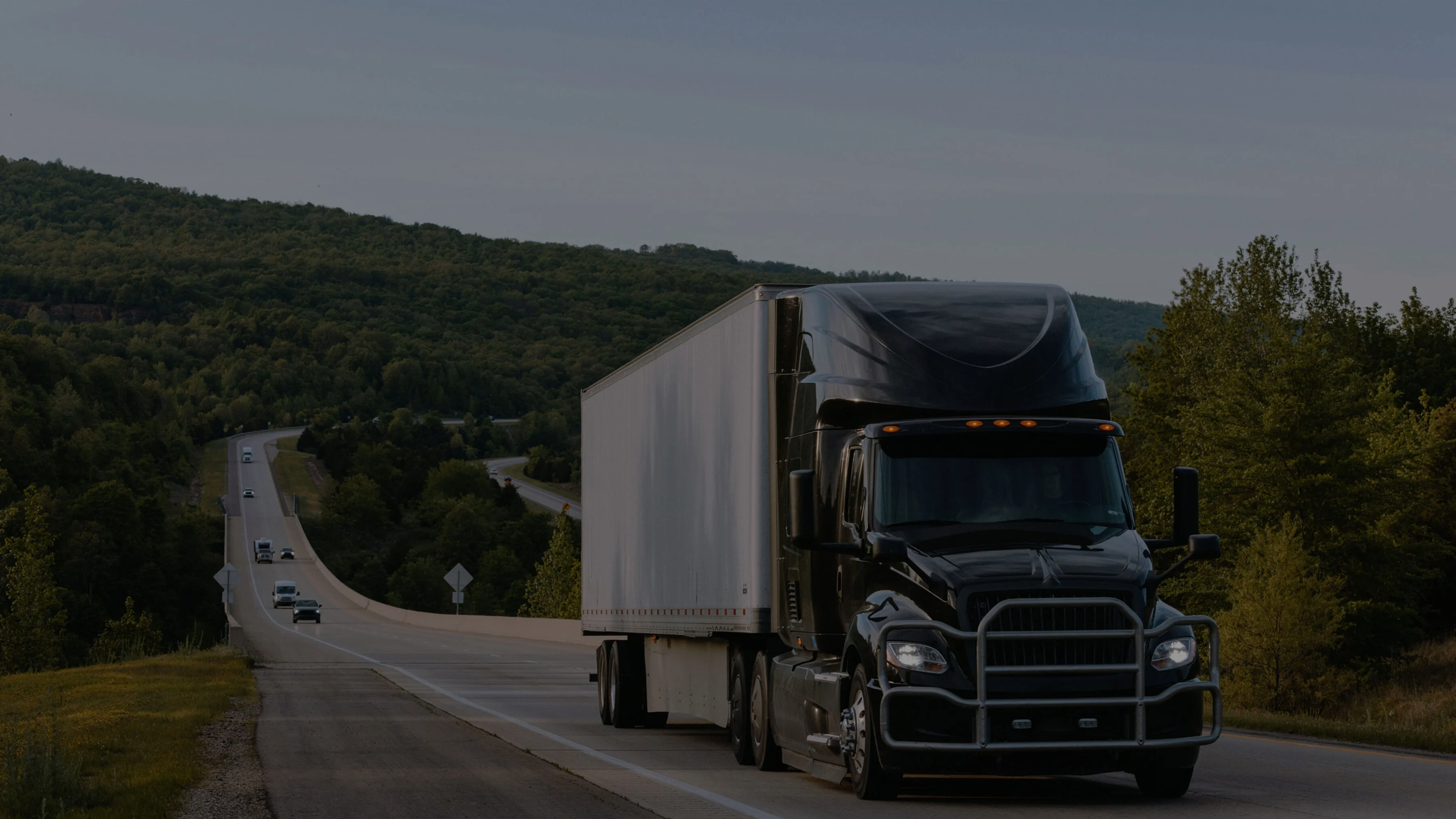 Truck driving on road.