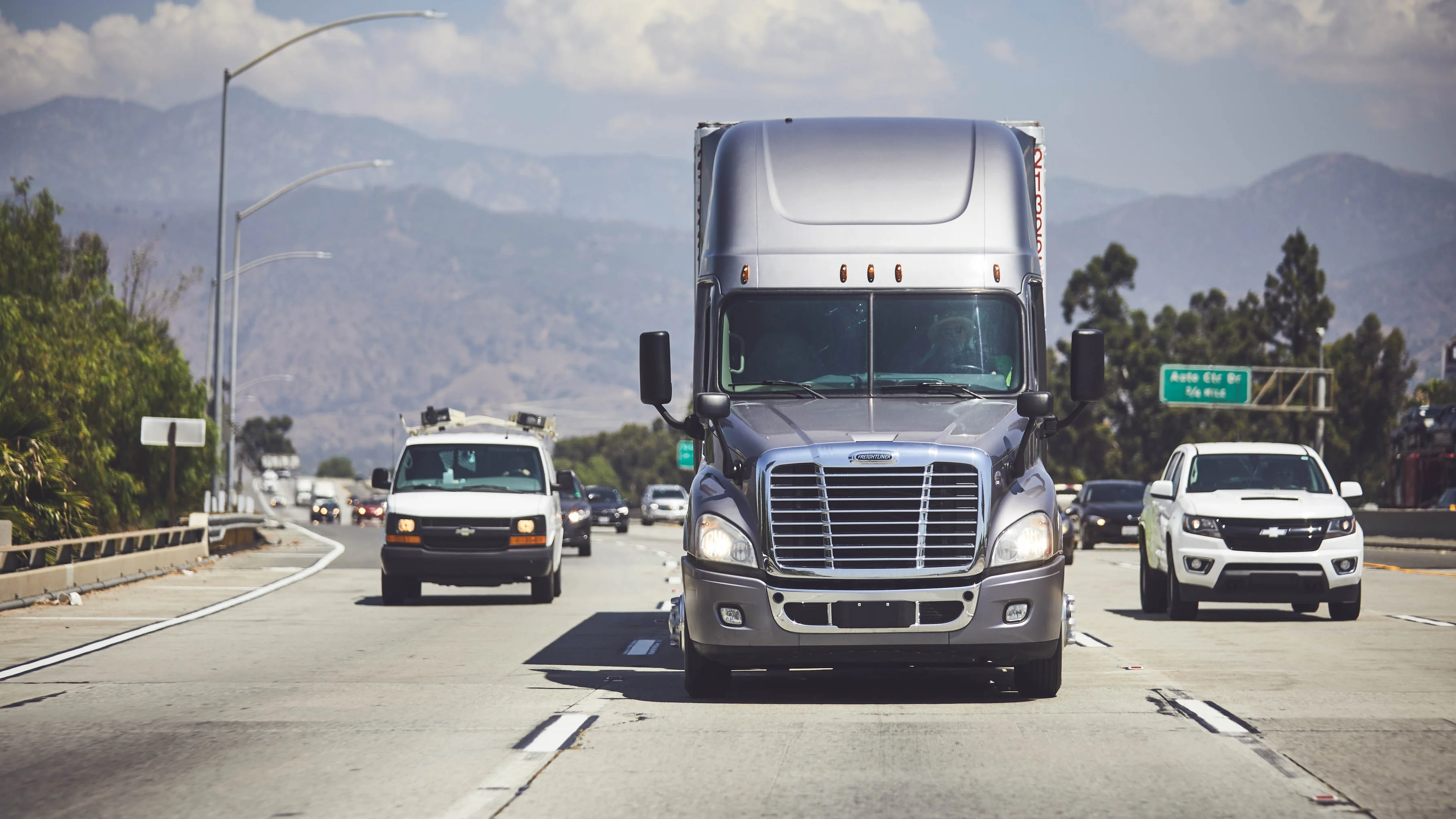 Truck driving through scenic highway, representing freight industry’s key moments in 2022.