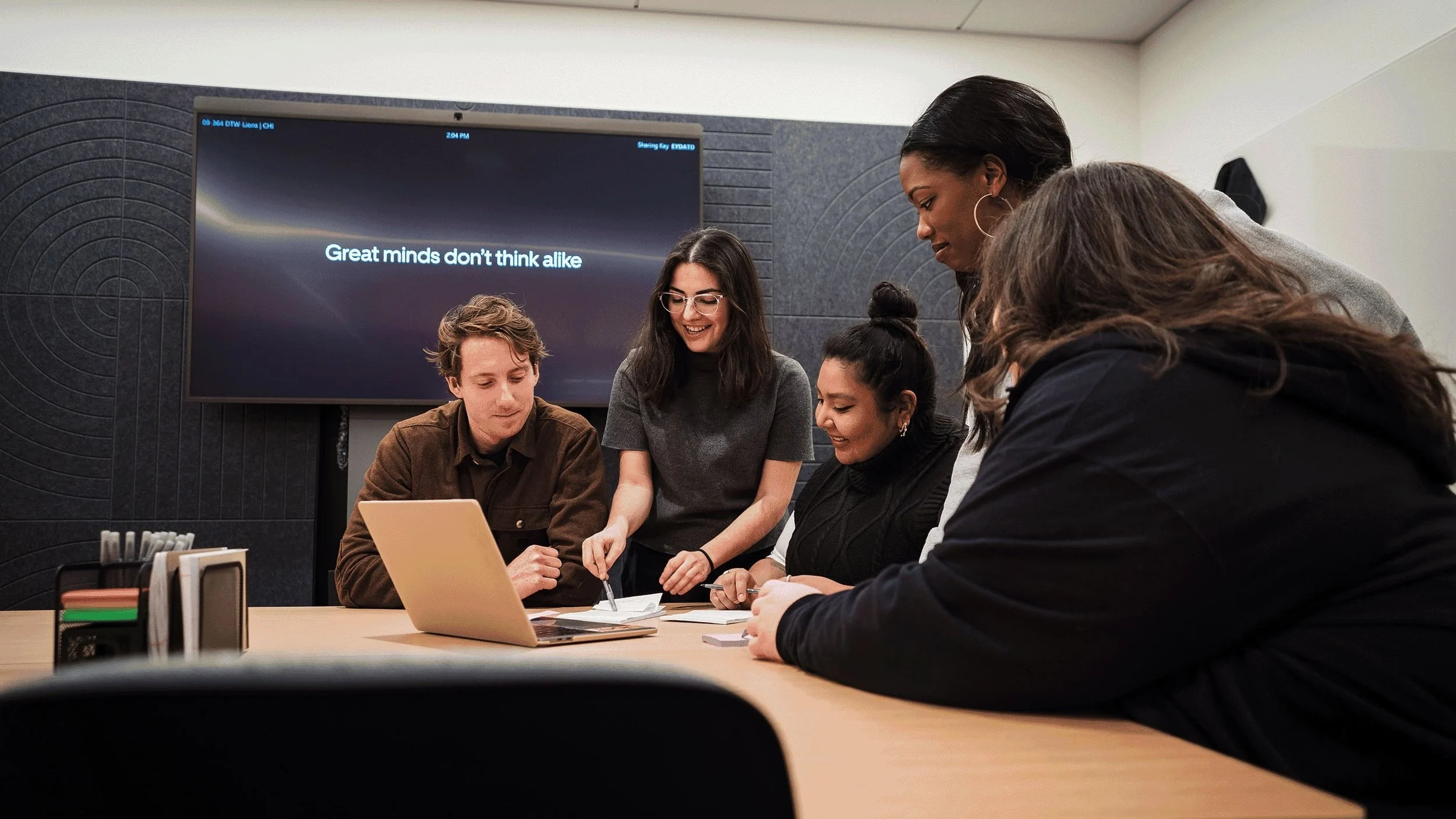 Group of people meeting at a table.