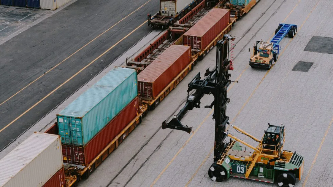 Containers being loaded onto rail cars.