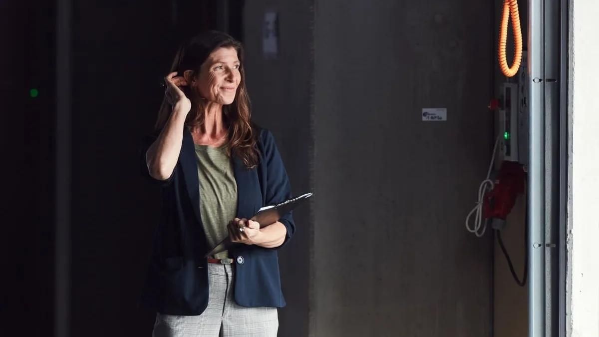 Woman smiling on loading dock.