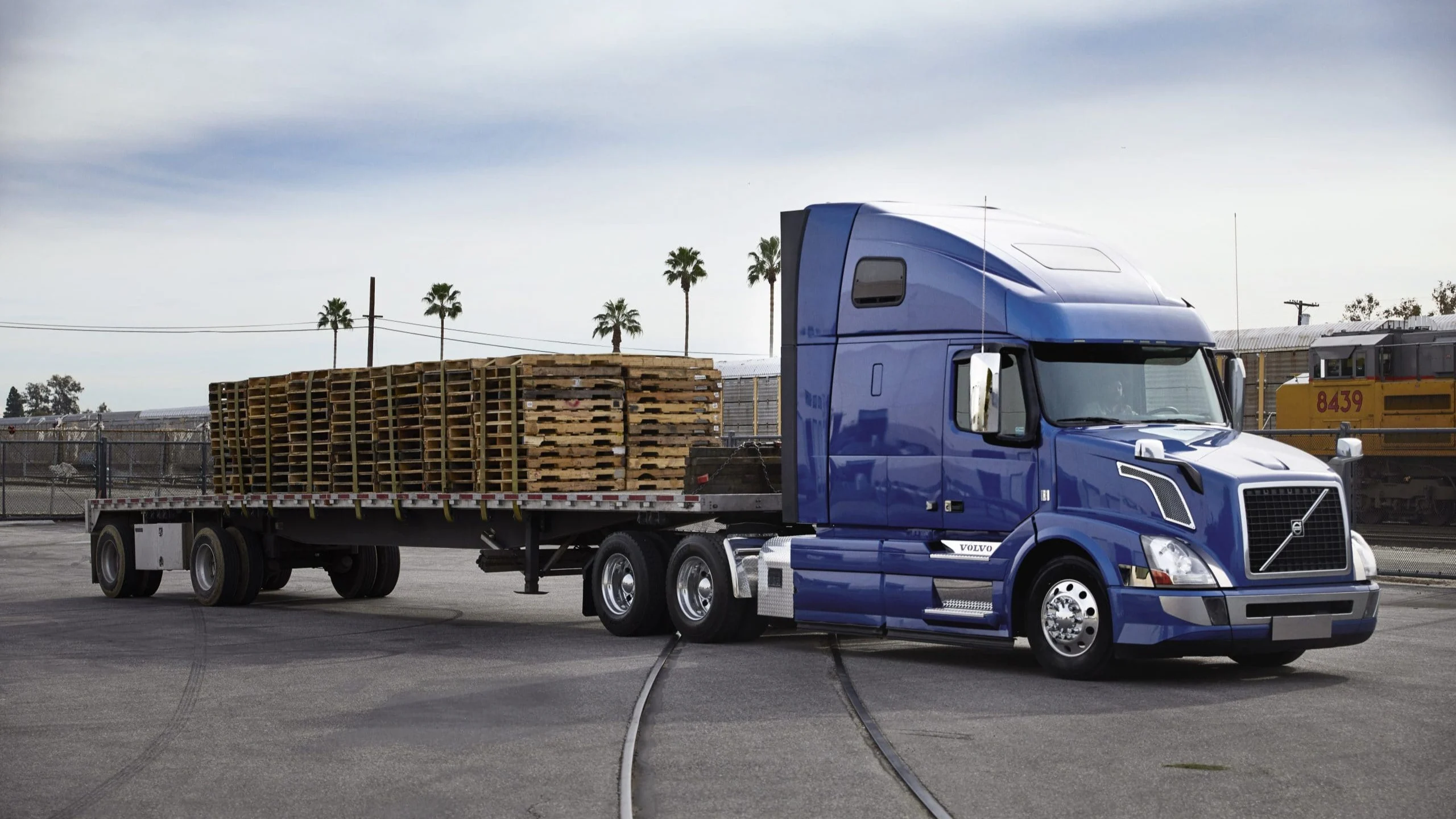 Blue truck with pallets.
