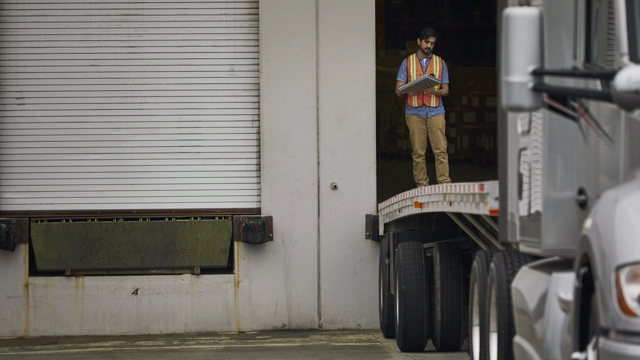 Man standing on loading dock.