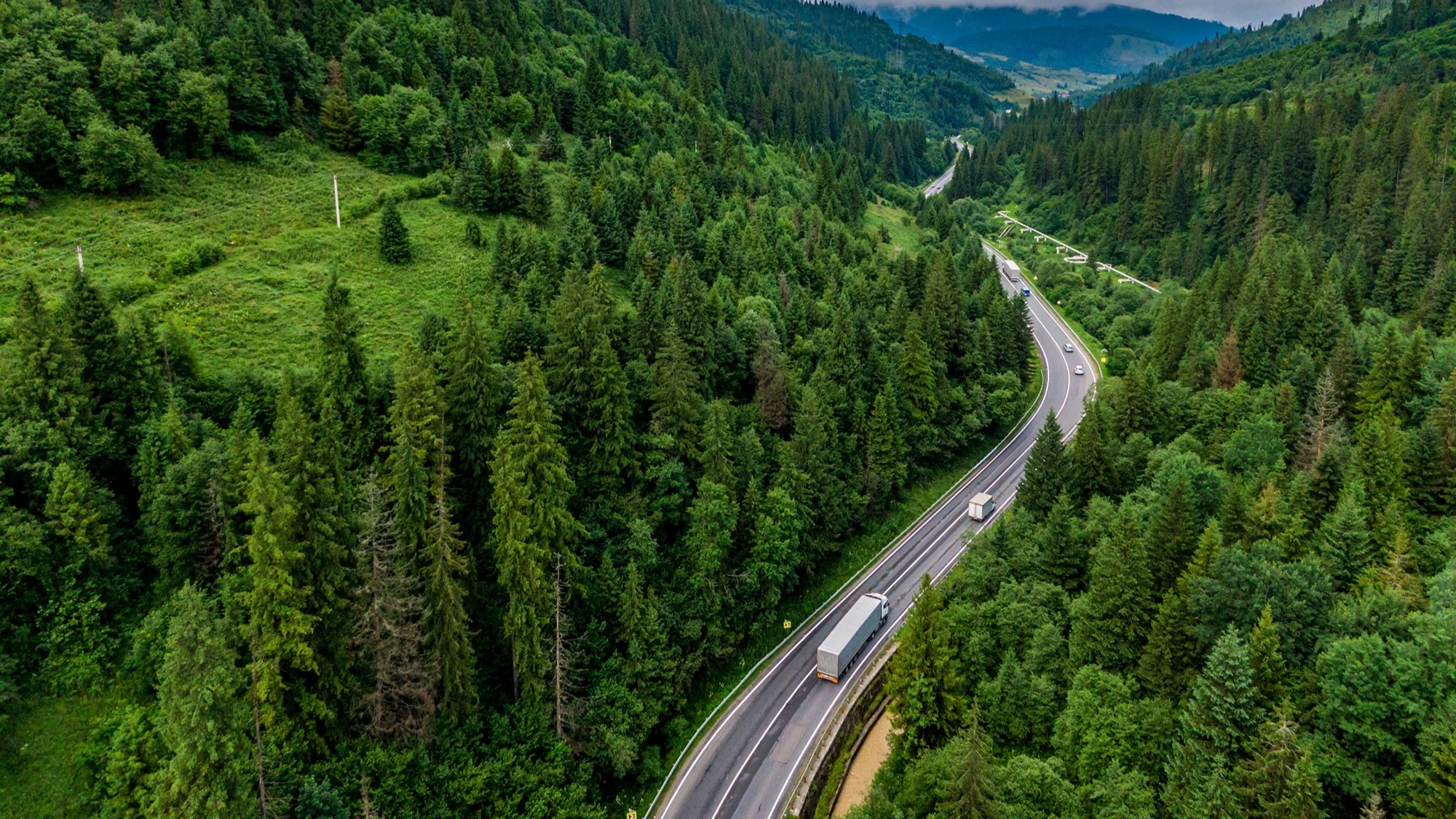Trucks on mountain road.