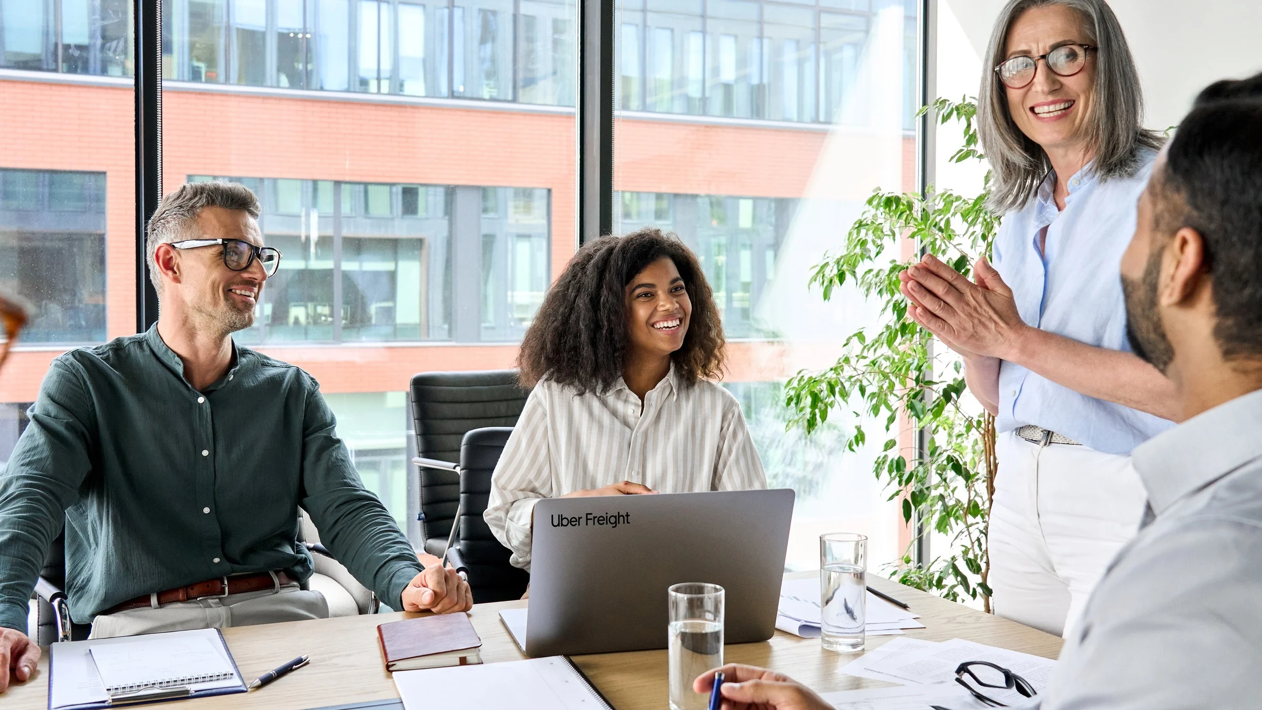 People having a dicussion in a conference room.