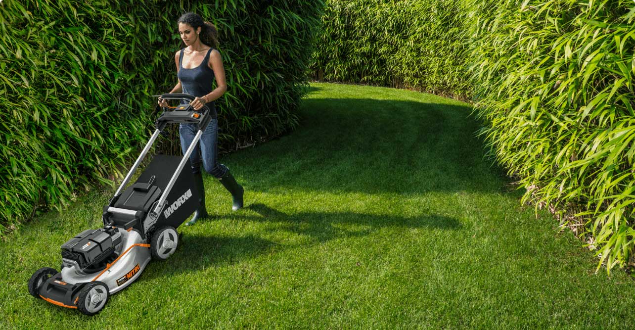 girl-cutting-grass-landscape