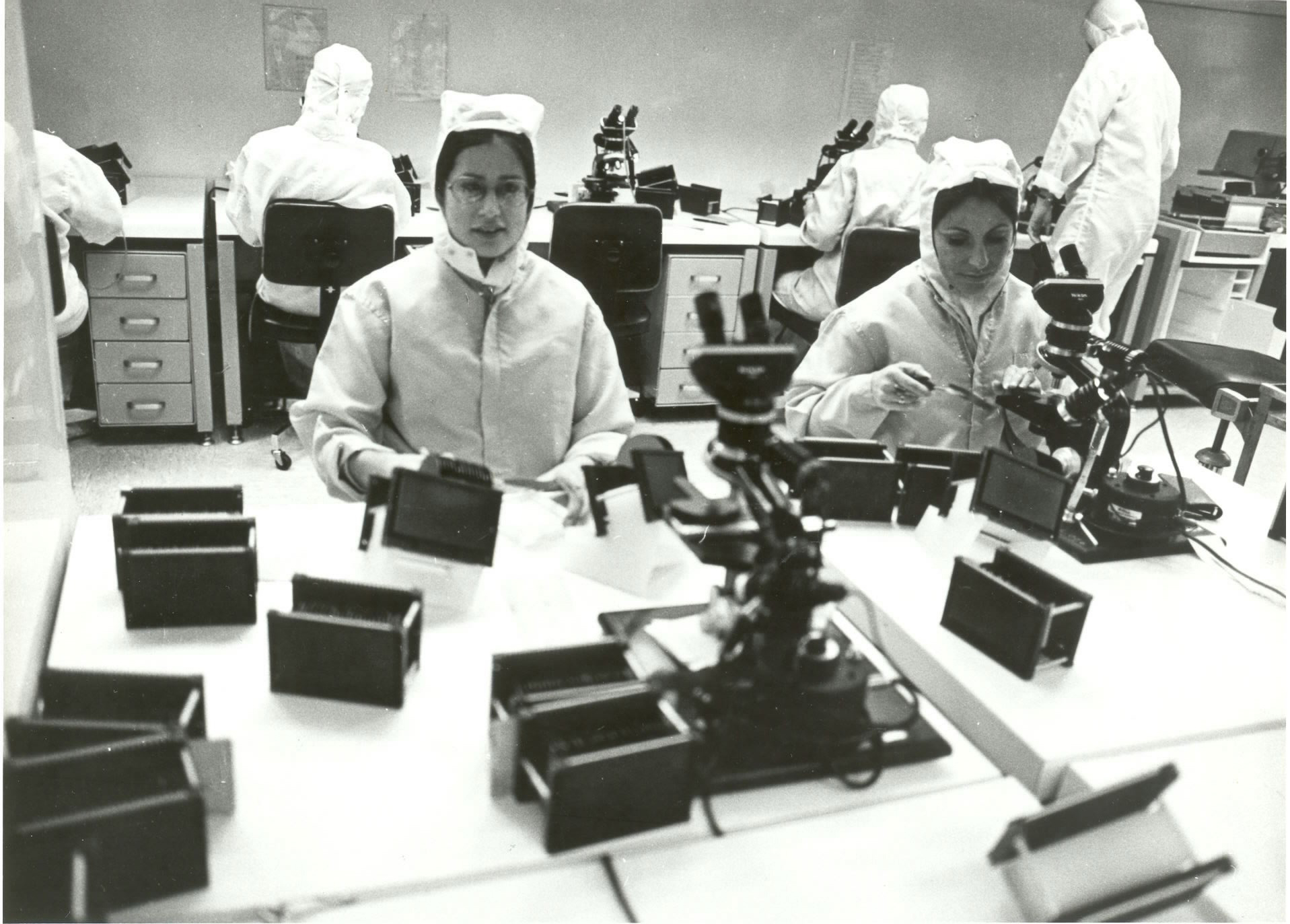 The first bunny suits were a great advancement for clean room protocols, but Intel would continue to refine the design. Eventually, cleans suits would include full hoods with see-through face masks.   